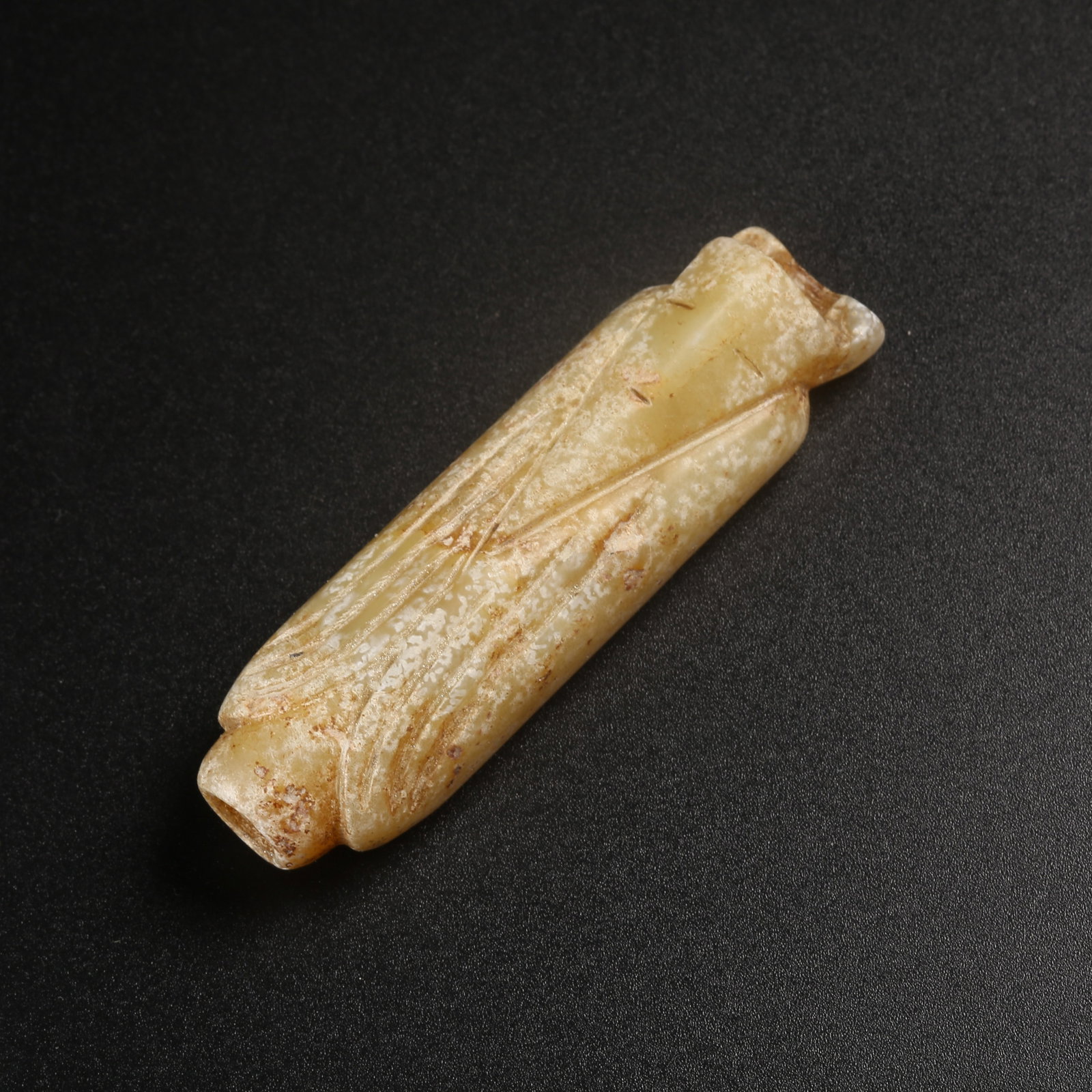 A ARCHAIC JADE WENGZHONG FIGURE: Archaic jade Wengzhong figure