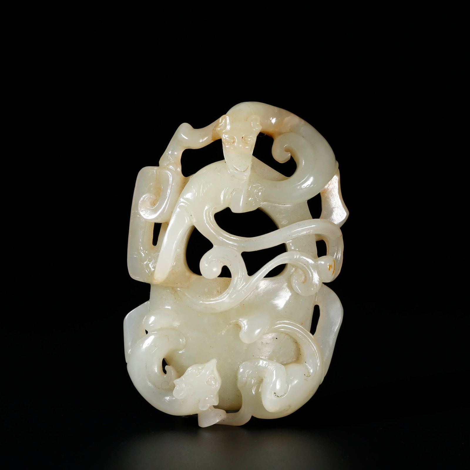 A HEART-SHAPED PENDANT CARVED WITH DRAGON MOTIFS FROM HETIAN JADE (1 of 9)