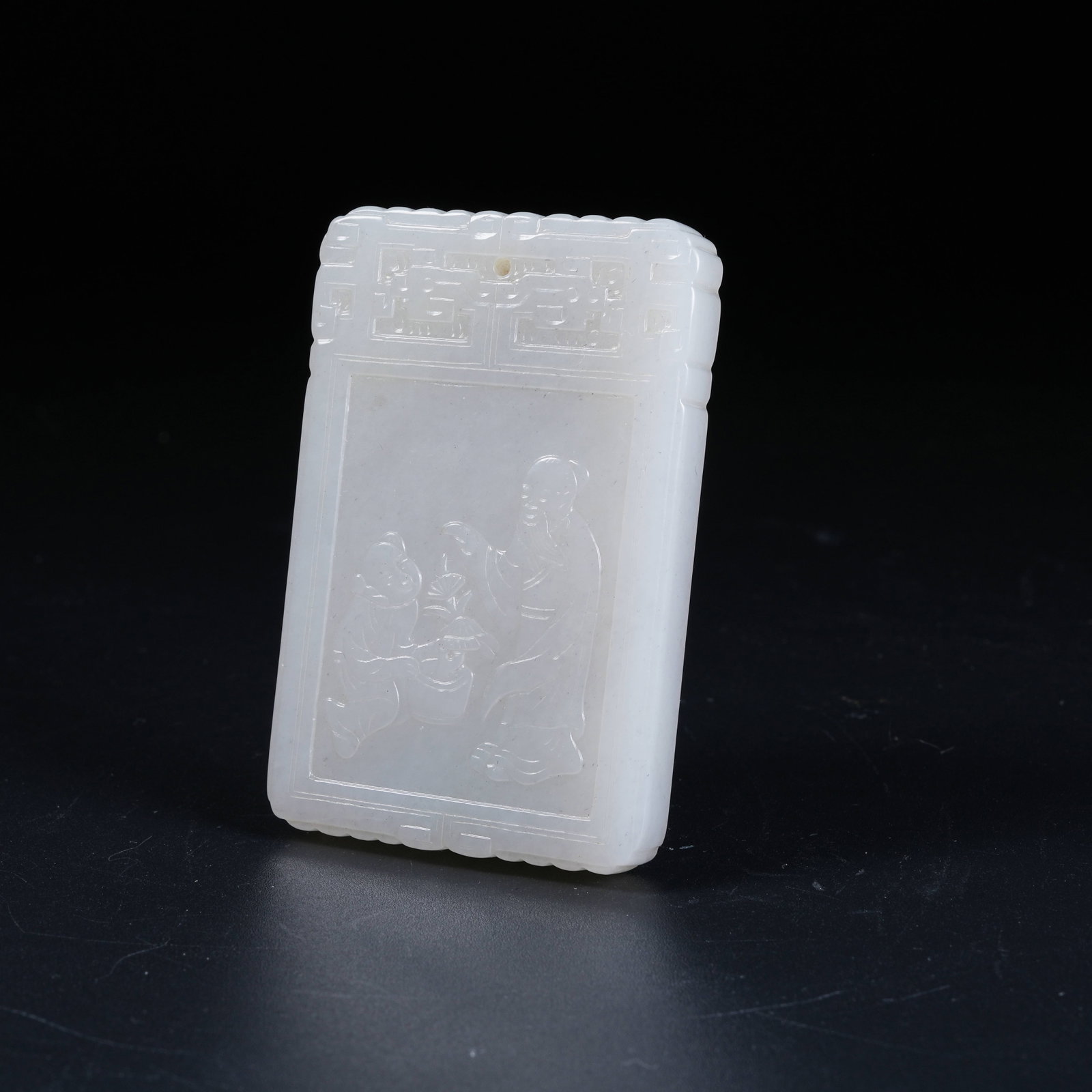 A HETIAN WHITE JADE PENDANT CARVED WITH HUMAN FIGURES (1 of 8)