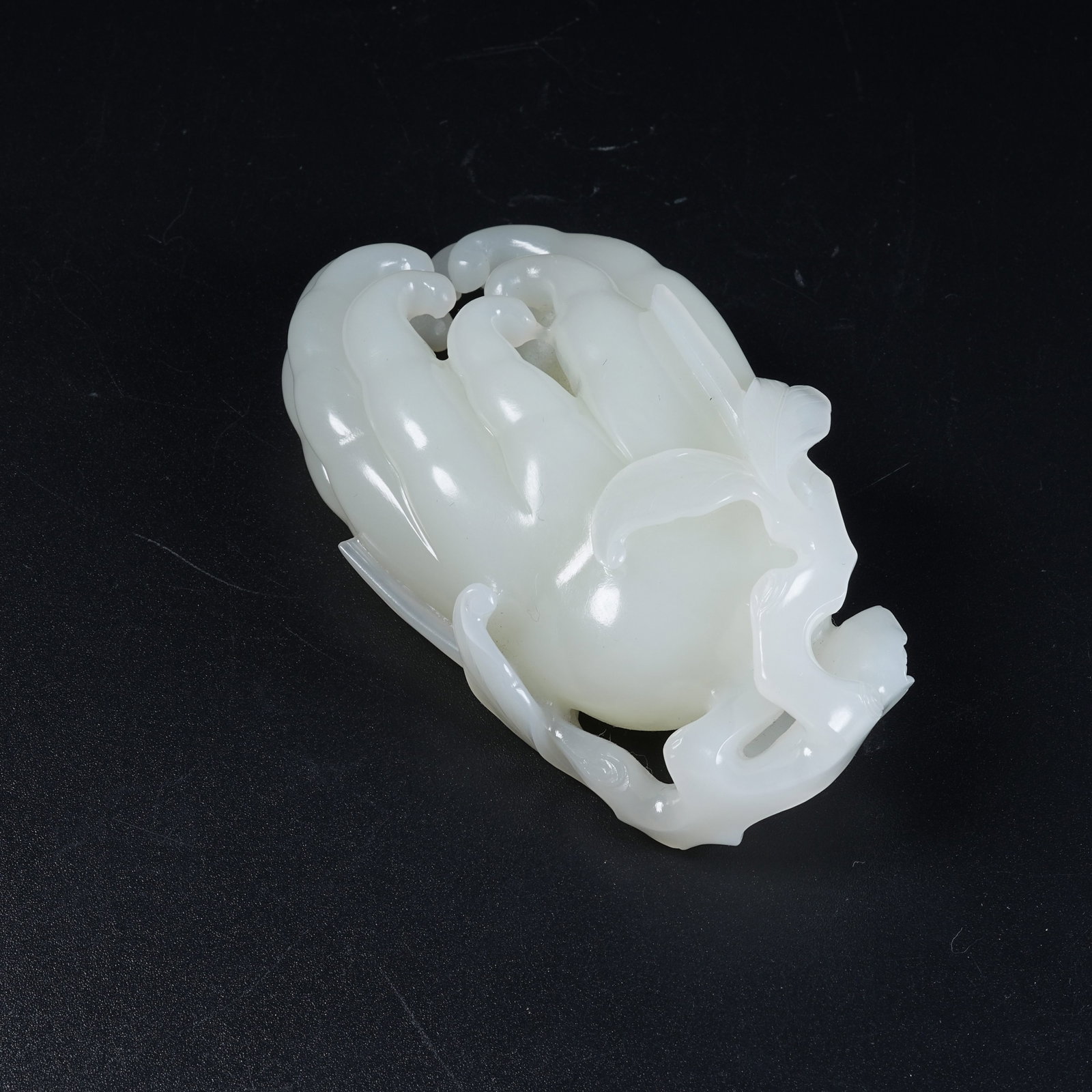 A HETIAN WHITE JADE BUDDHA'S HAND ORNAMENT: Hetian White Jade Buddha's Hand Ornament