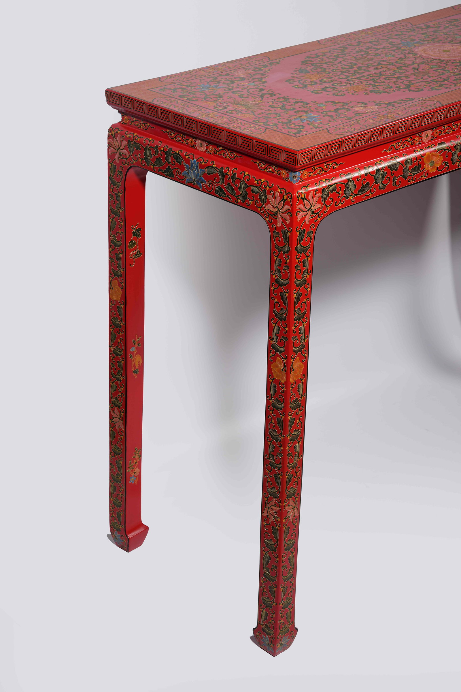 A RED CARVED LACQUER SIDE TABLE WITH INTERLOCKING FLORAL PATTERNS - 10