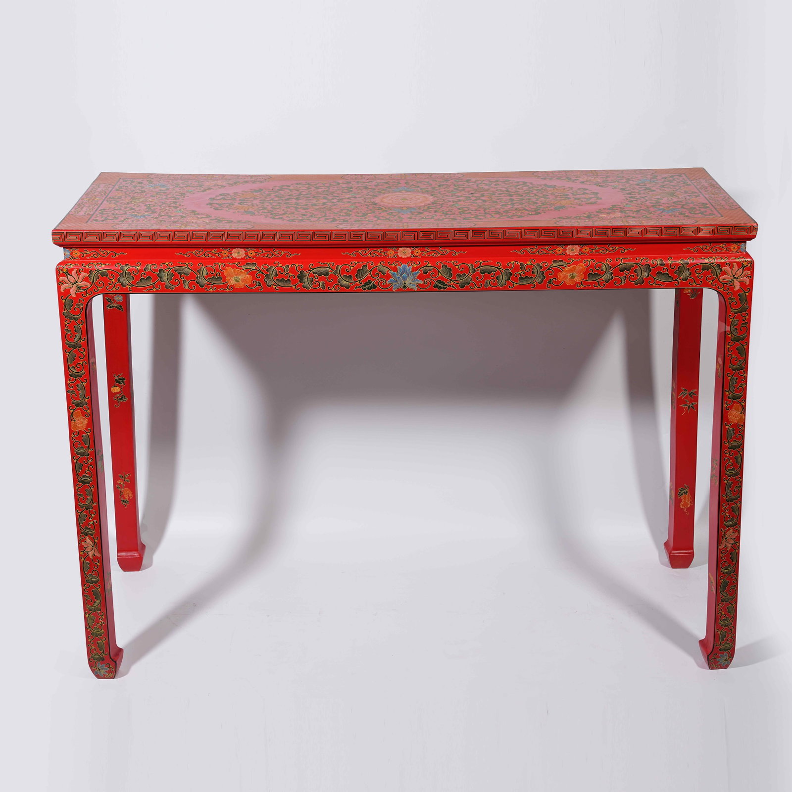 A RED CARVED LACQUER SIDE TABLE WITH INTERLOCKING FLORAL PATTERNS - 12