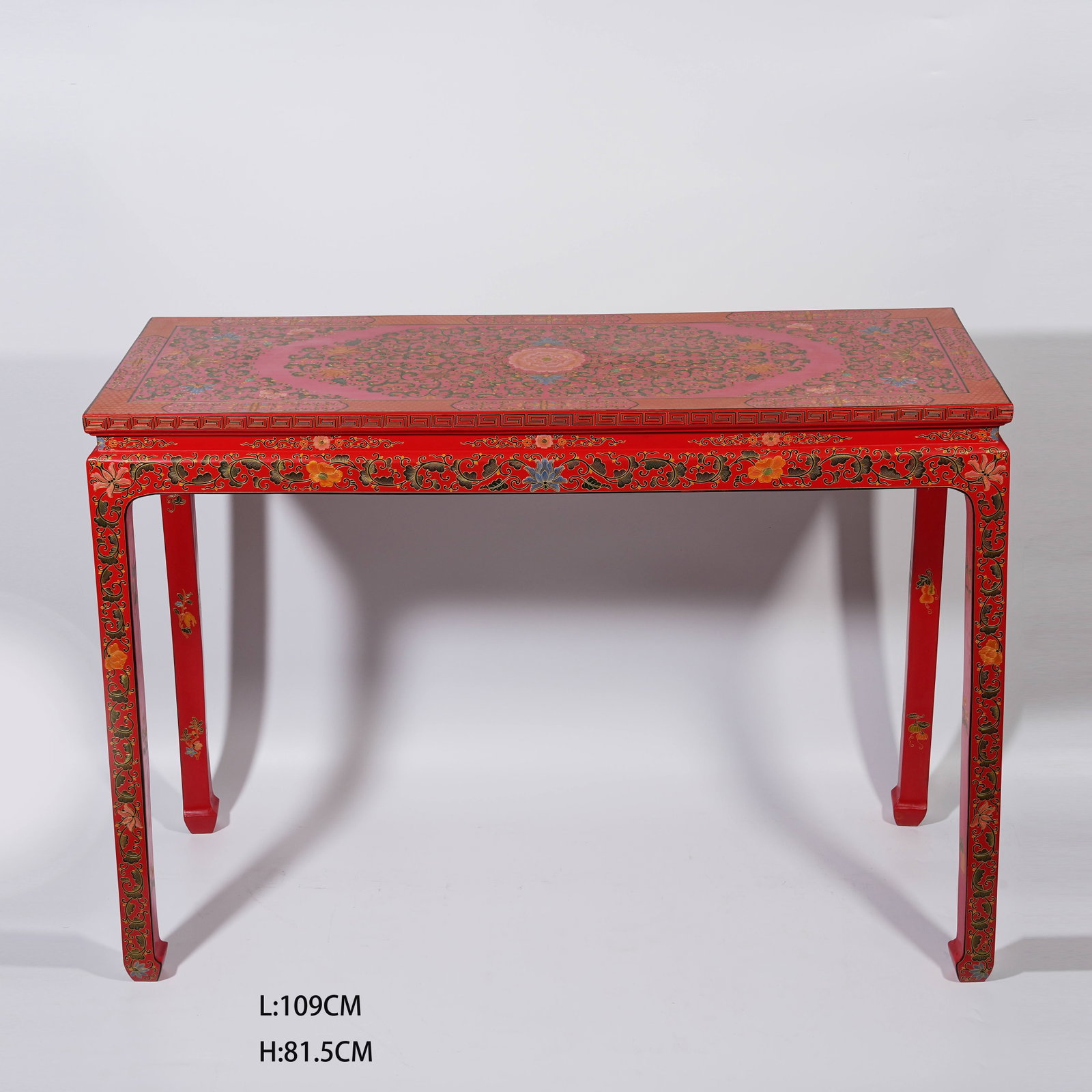 A RED CARVED LACQUER SIDE TABLE WITH INTERLOCKING FLORAL PATTERNS (1 of 14)