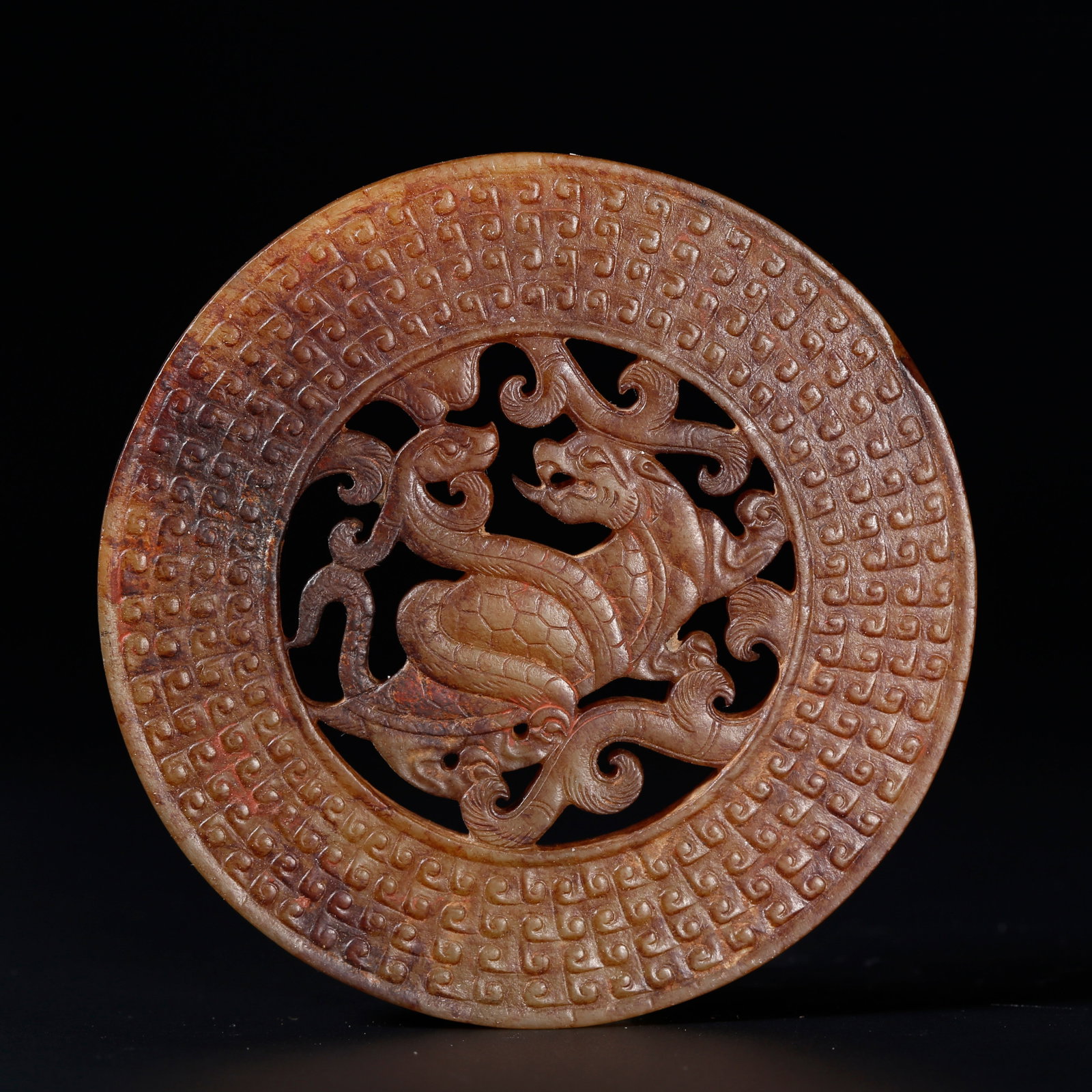 A ANCIENT JADE BI DISC CARVED WITH XUANWU PATTERNS: Ancient Jade Bi Disc Carved with Xuanwu Patterns