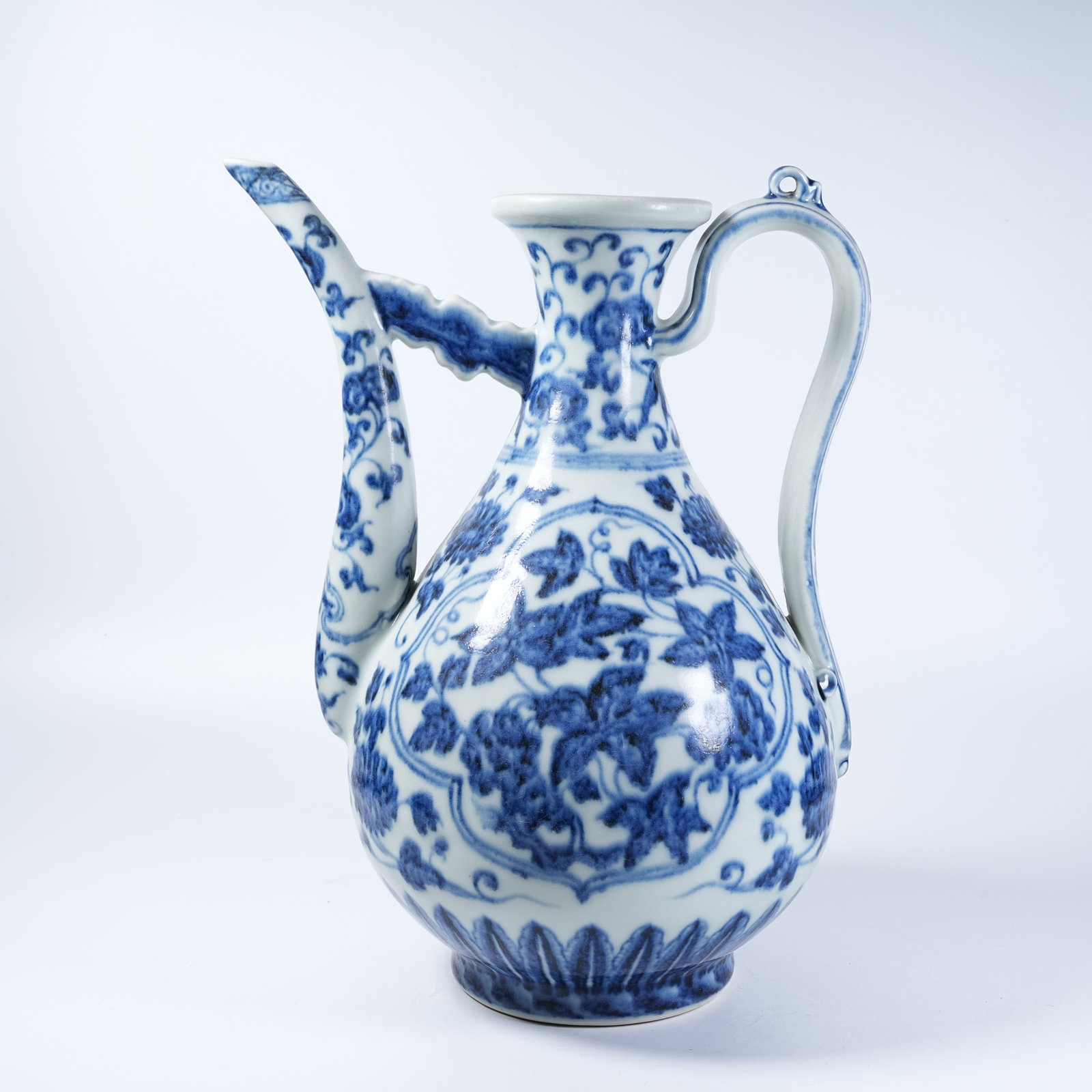 A EWER WITH BLUE AND WHITE FLORAL PATTERNS: Ewer with Blue and White Floral Patterns