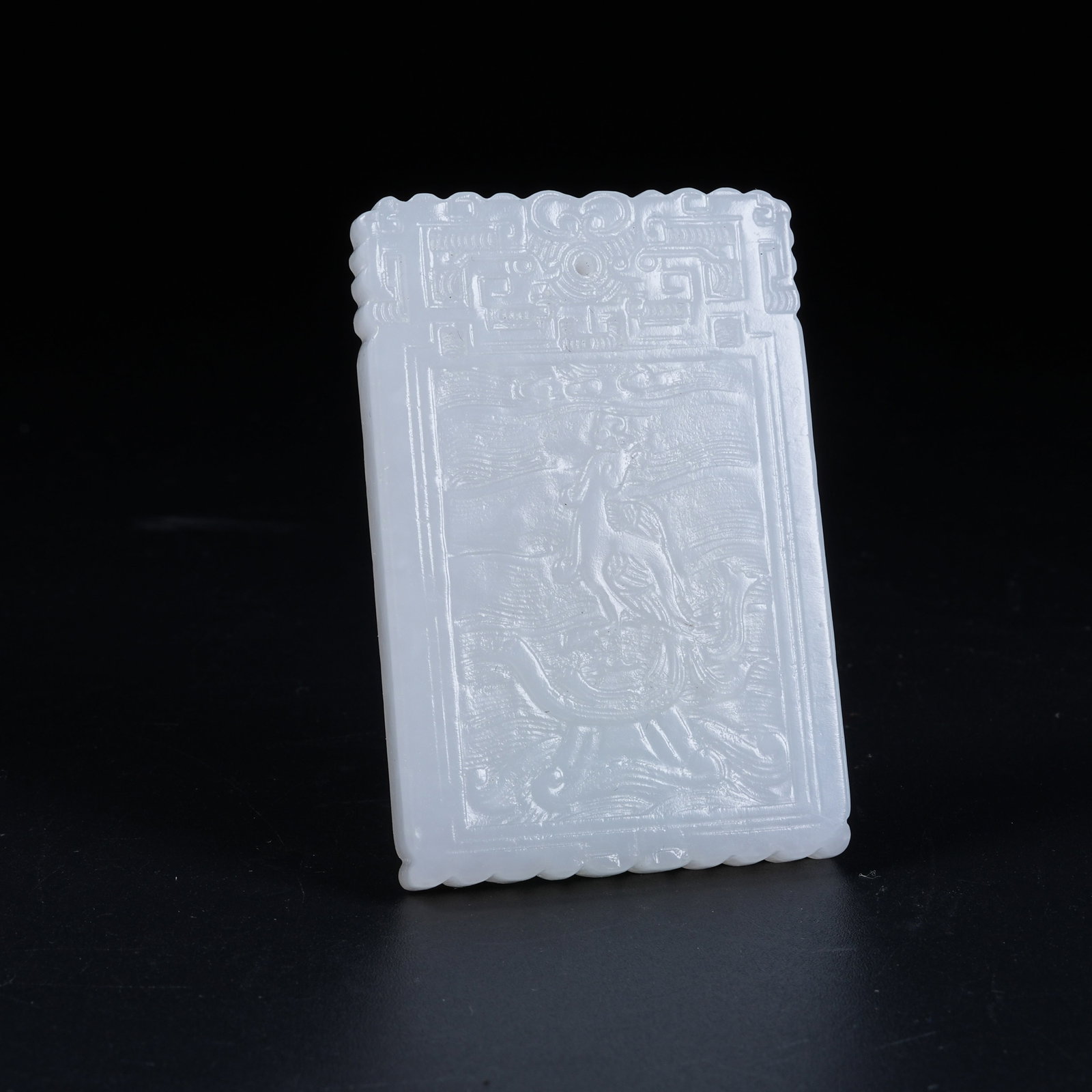 A HETIAN WHITE JADE PENDANT CARVED WITH DRAGON-TORTOISE BEARING PHOENIX PATTERN: Hetian White Jade Pendant Carved with Dragon-Tortoise Bearing Phoenix Pattern