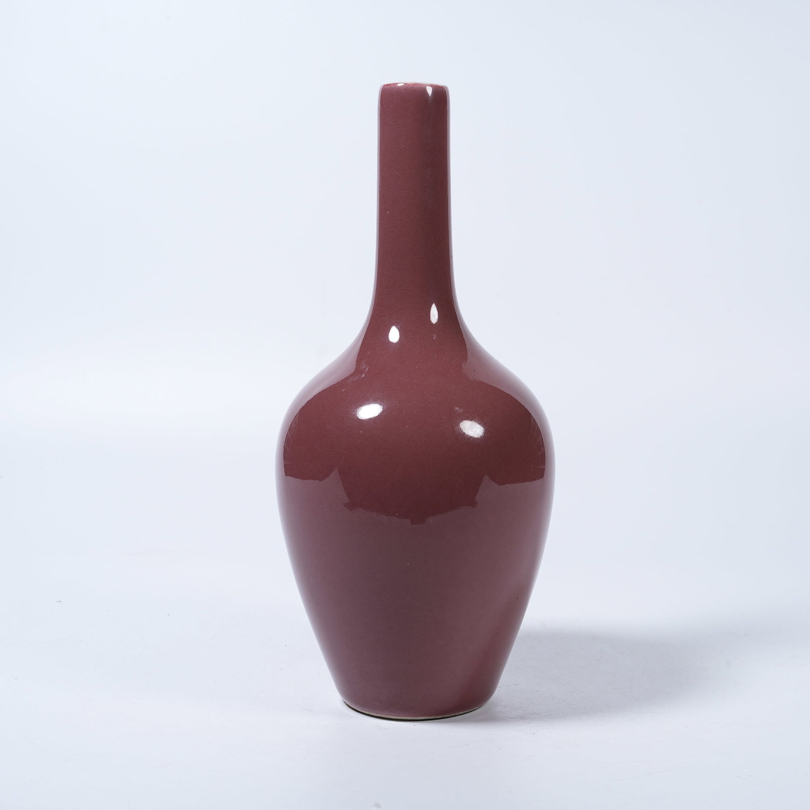 A SACRIFICIAL RED GLAZE LONG-NECK VASE: Sacrificial Red Glaze Long-Neck Vase