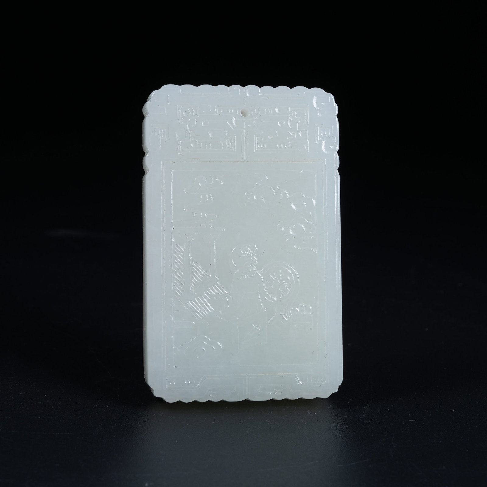 A HETIAN WHITE JADE PENDANT CARVED WITH HUMAN FIGURES: Hetian White Jade Pendant Carved with Human Figures