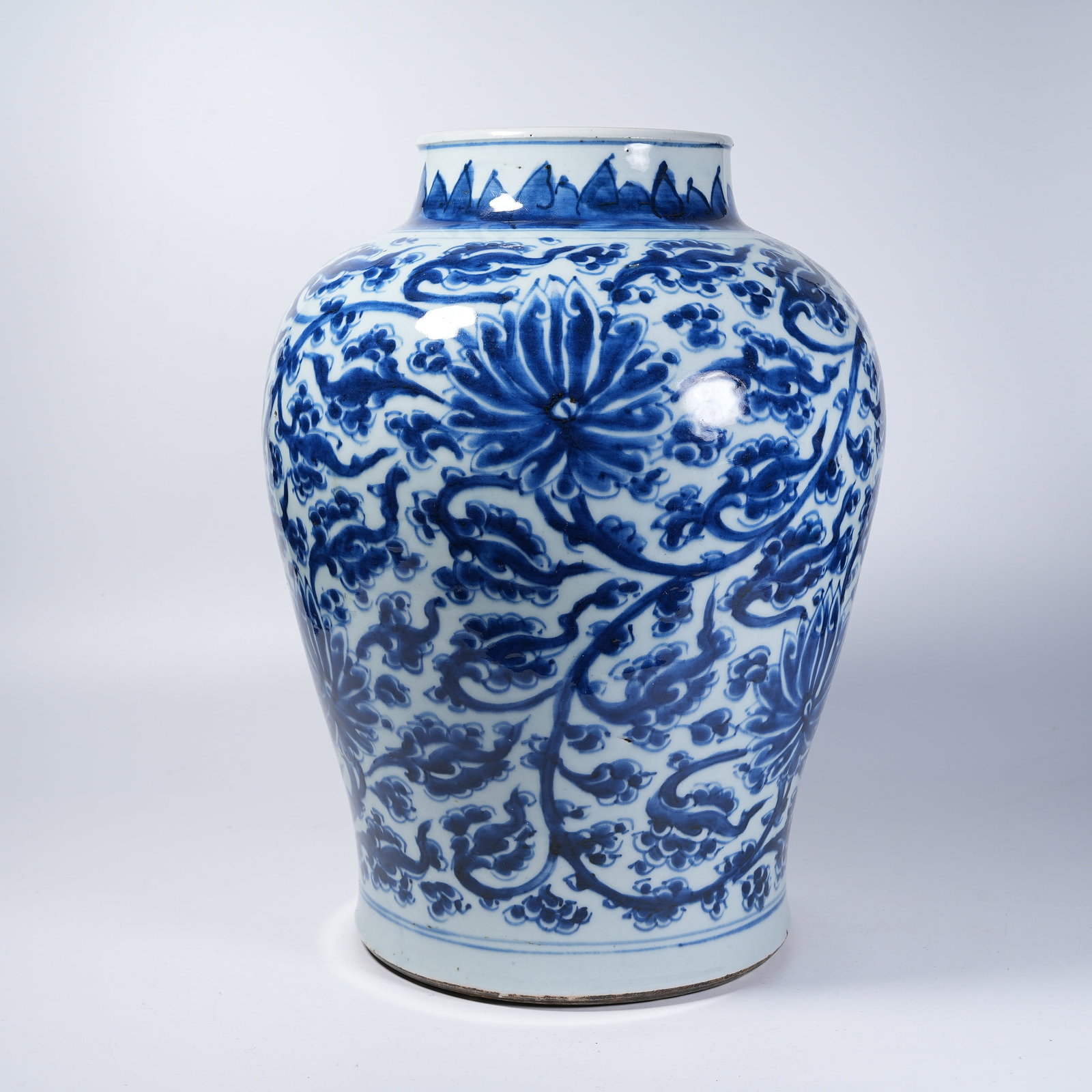 A JAR WITH BLUE AND WHITE INTERLOCKING FLORAL PATTERN: Jar with Blue and White Interlocking Floral Pattern