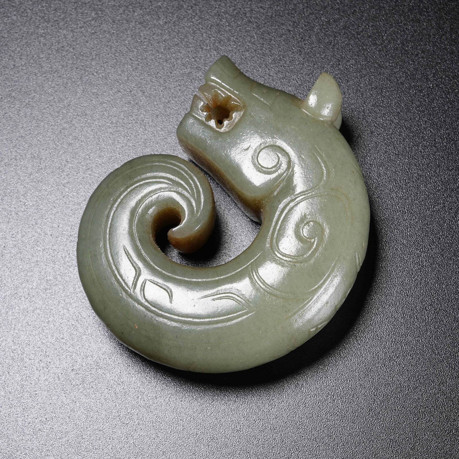 A C-SHAPED DRAGON PENDANT OF ANCIENT JADE: C-Shaped Dragon Pendant of Ancient Jade