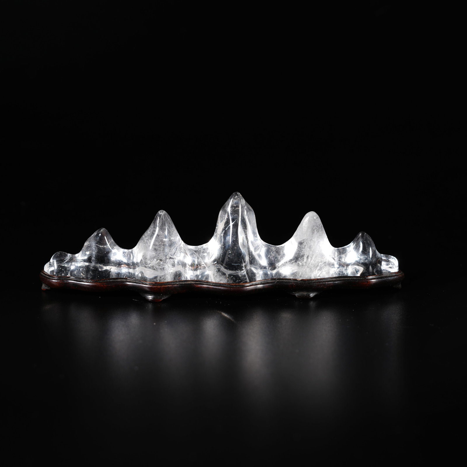 A ROCK CRYSTAL CARVED MOUNTAIN-FORM BRUSH REST: Rock Crystal Carved Mountain-Form Brush Rest