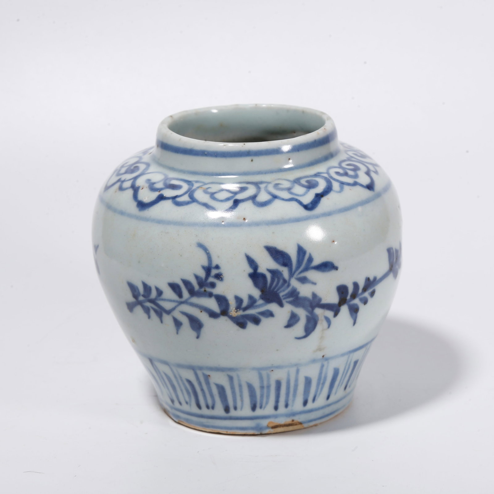 A BLUE AND WHITE JAR WITH INTERLOCKING FLORAL SCROLLS: Blue and White Jar with Interlocking Floral Scrolls