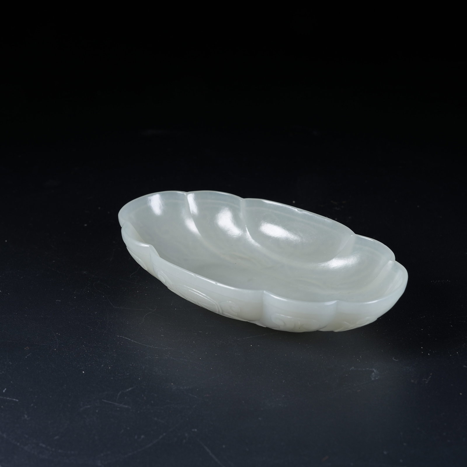 A HETIAN JADE FLOWER-RIMMED WASHER CARVED WITH FLORAL PATTERNS (1 of 10)