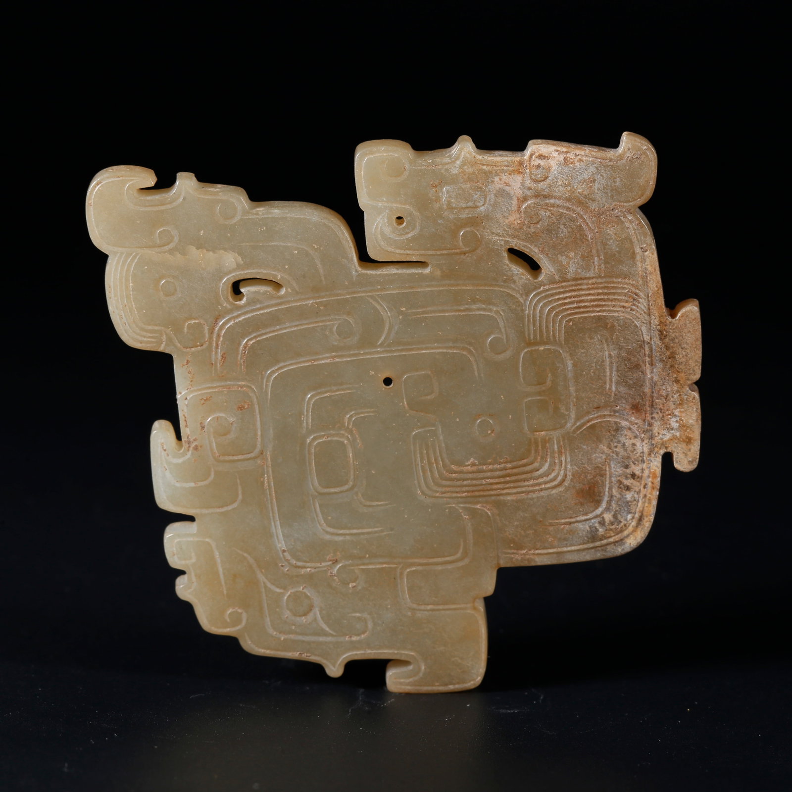 A ARCHAIC JADE PENDANT CARVED WITH DRAGON PATTERNS: Archaic Jade Pendant Carved with Dragon Patterns