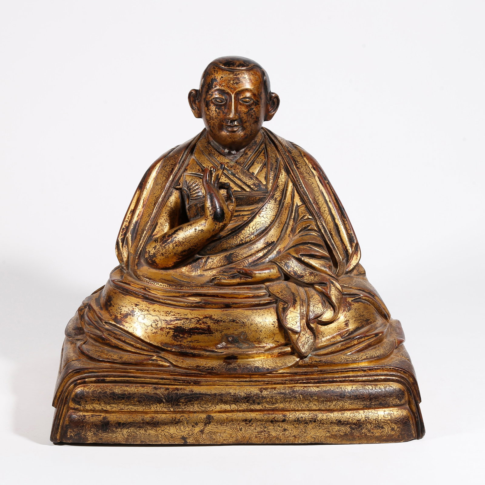 A GILT BRONZE LAMA STATUE (1 of 9)