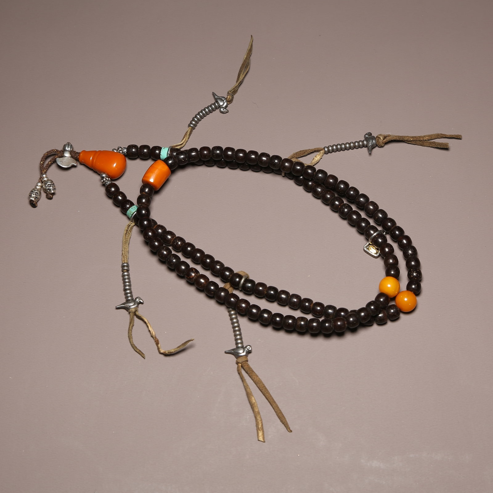 A STRAND OF ROSEWOOD PRAYER BEADS (1 of 8)