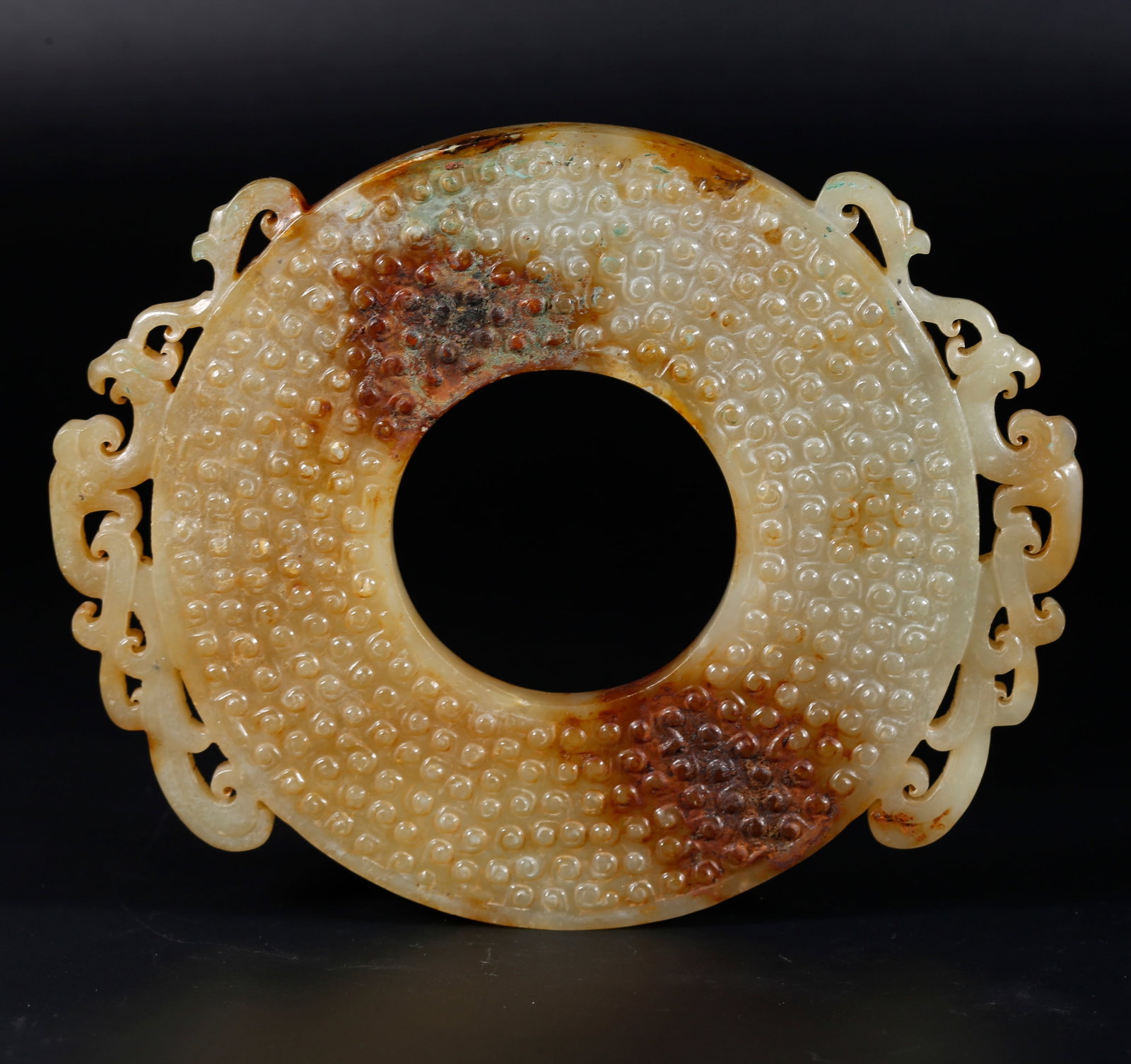 A ARCHAIC JADE BI DISC WITH NIPPLE BOSS PATTERNS (1 of 10)