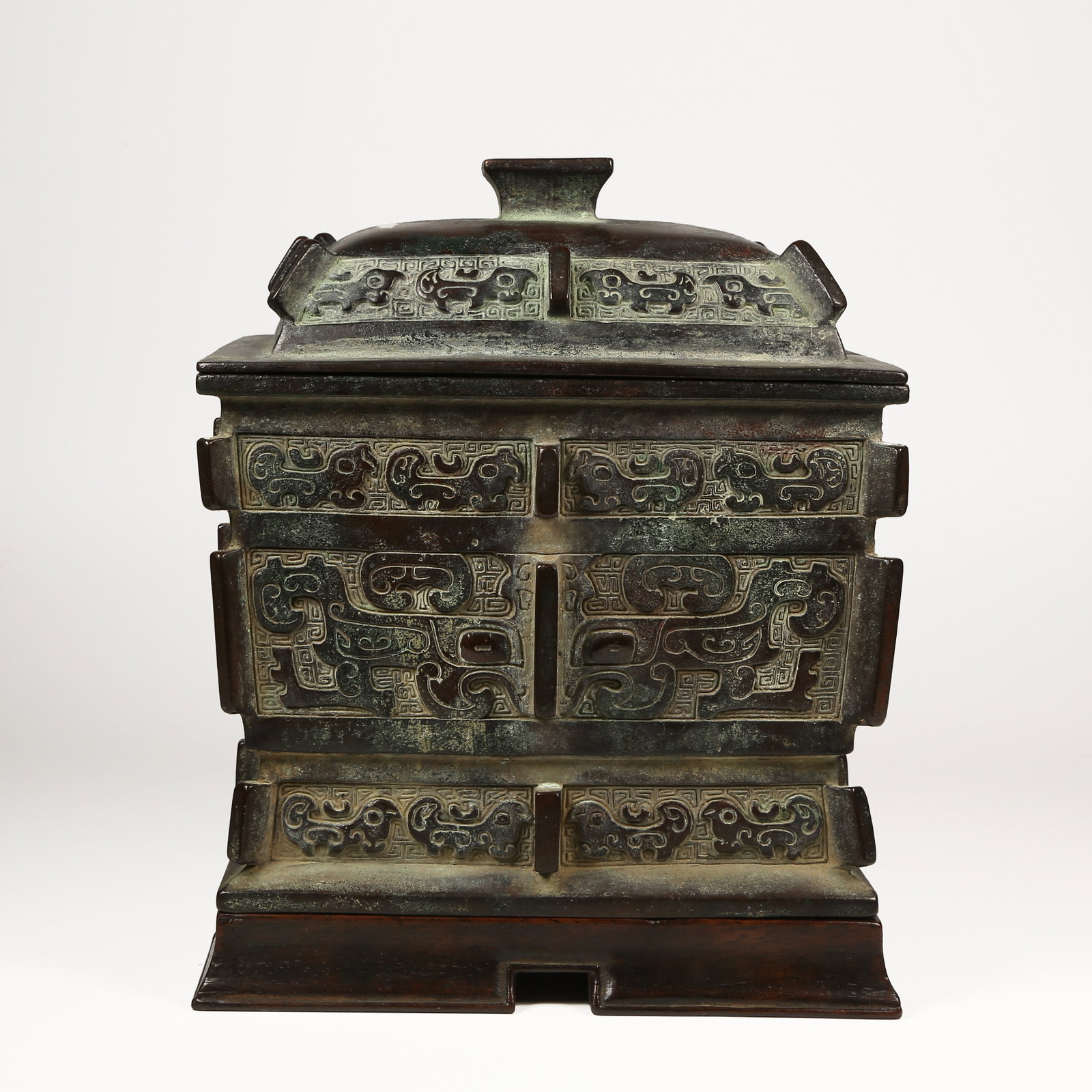 A BRONZE FU VESSEL WITH ANIMAL-FACE MOTIFS AND UPRIGHT FINIALS: Bronze Fu Vessel with Animal-Face Motifs and Upright Finials