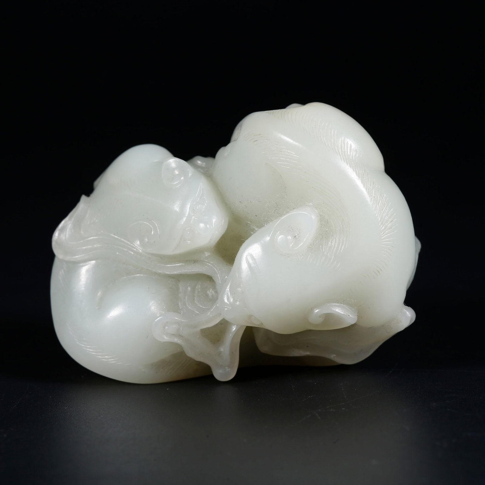 A HETIAN JADE BEAST ORNAMENT (1 of 9)