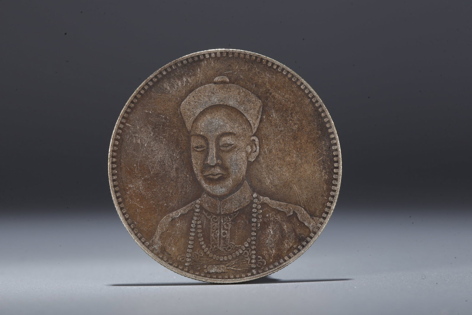 A SILVER DOLLAR COIN - 3