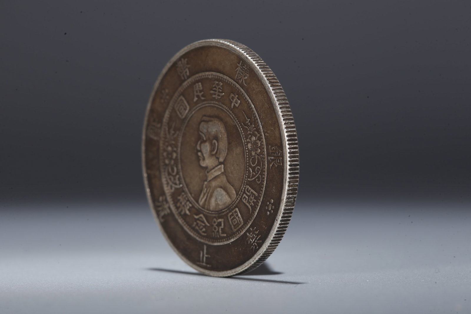 A SILVER DOLLAR COIN - 2
