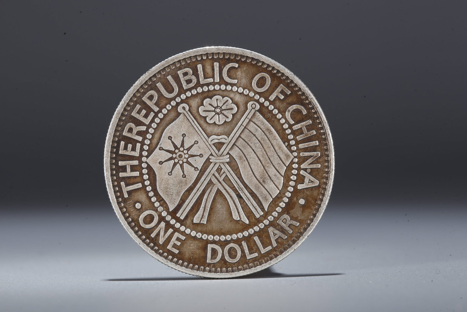 A SILVER DOLLAR COIN - 3