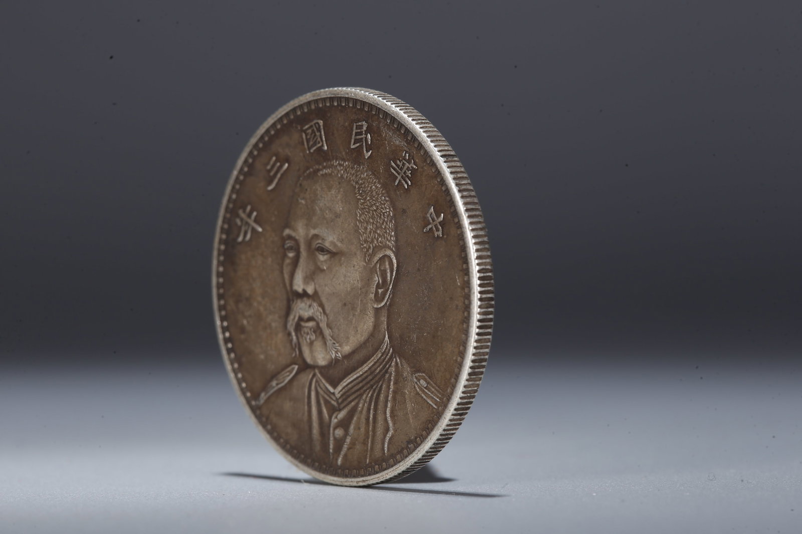 A SILVER DOLLAR COIN - 2