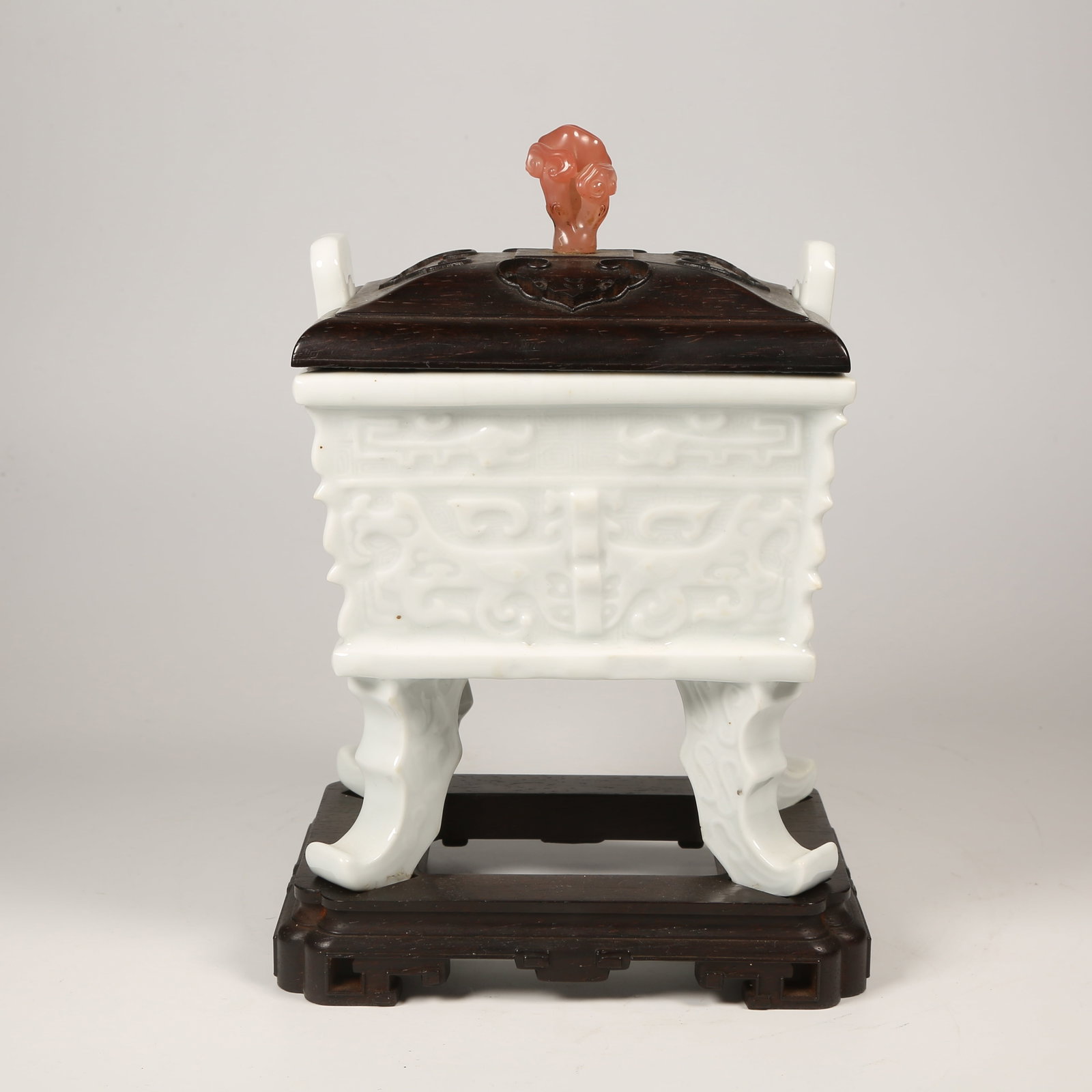 A WHITE PORCELAIN DING-SHAPED CENSER WITH ANIMAL-FACE MOTIFS AND UPRIGHT FINIALS: White Porcelain Ding-Shaped Censer with Animal-Face Motifs and Upright Finials