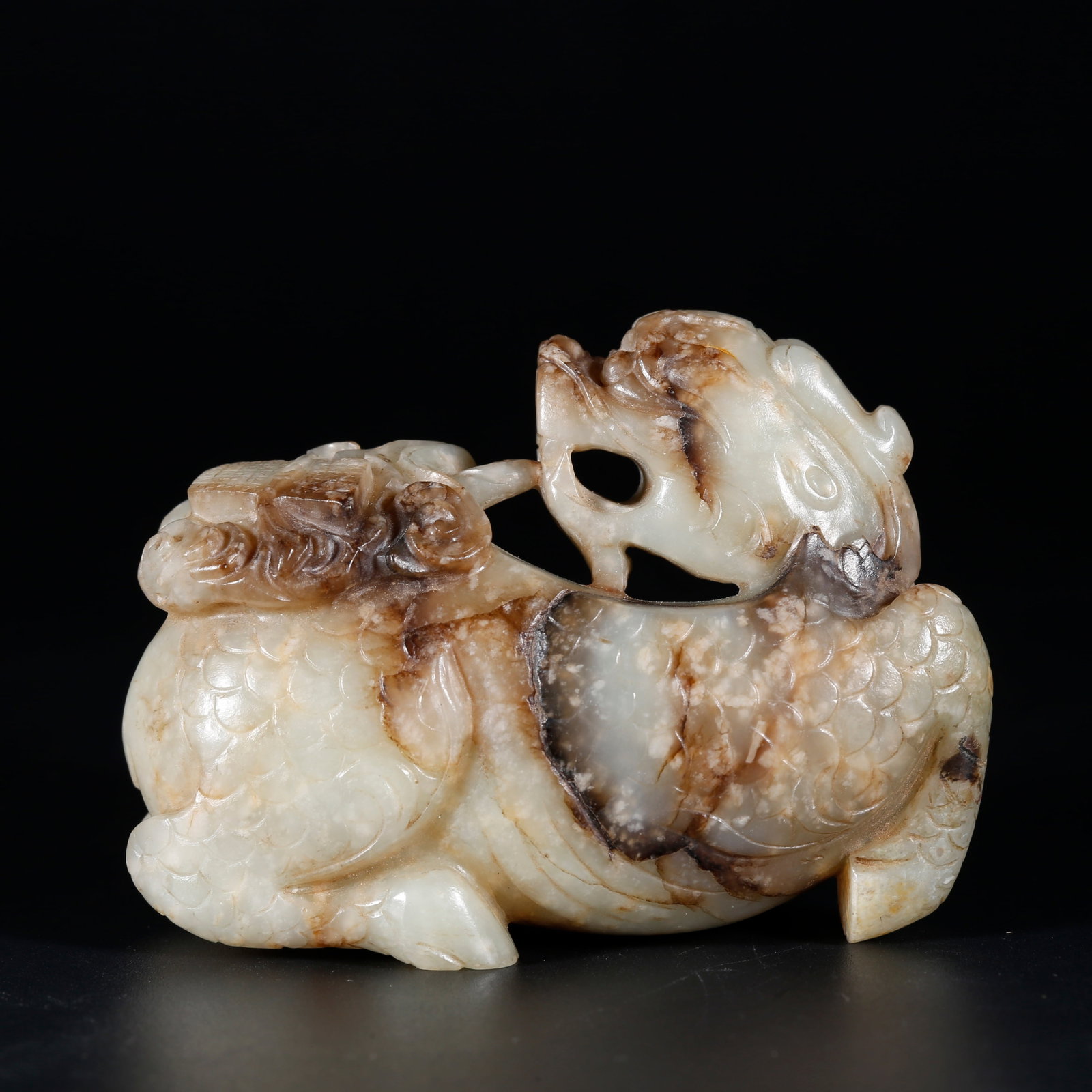 A HETIAN JADE ORNAMENT OF QILIN BEARING SCROLLS (1 of 9)