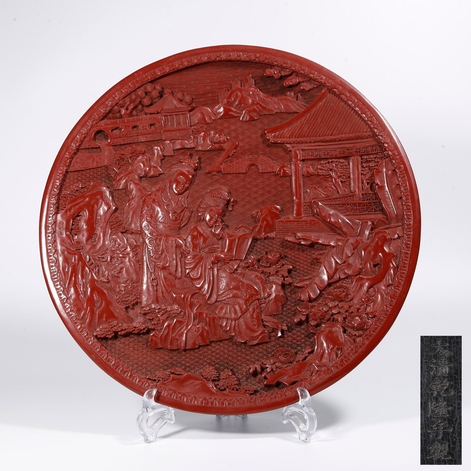 A CARVED RED LACQUER PLATE WITH NARRATIVE FIGURE SCENES: Carved Red Lacquer Plate with Narrative Figure Scenes