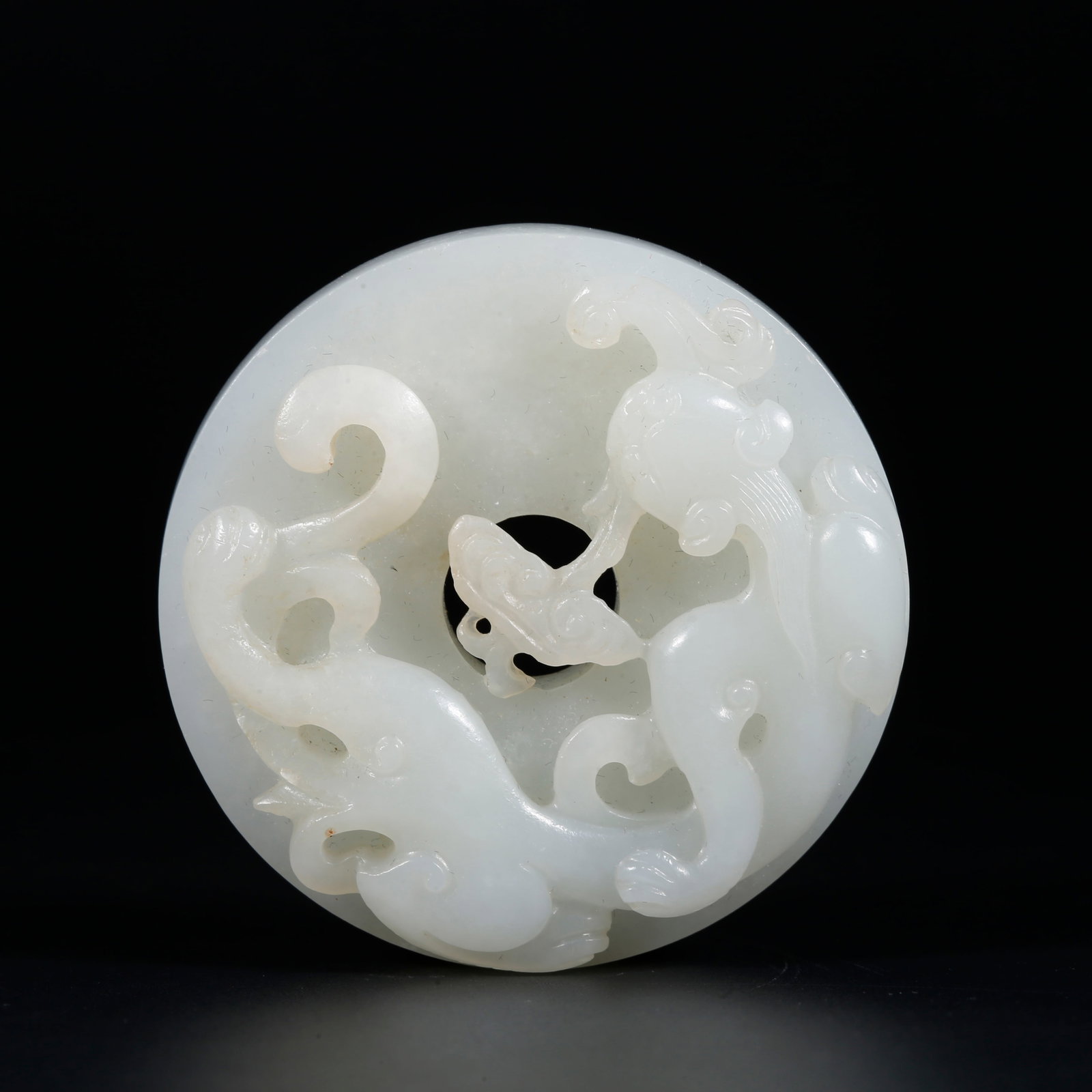 A HETIAN JADE BI DISC CARVED WITH DRAGON PATTERNS (1 of 9)