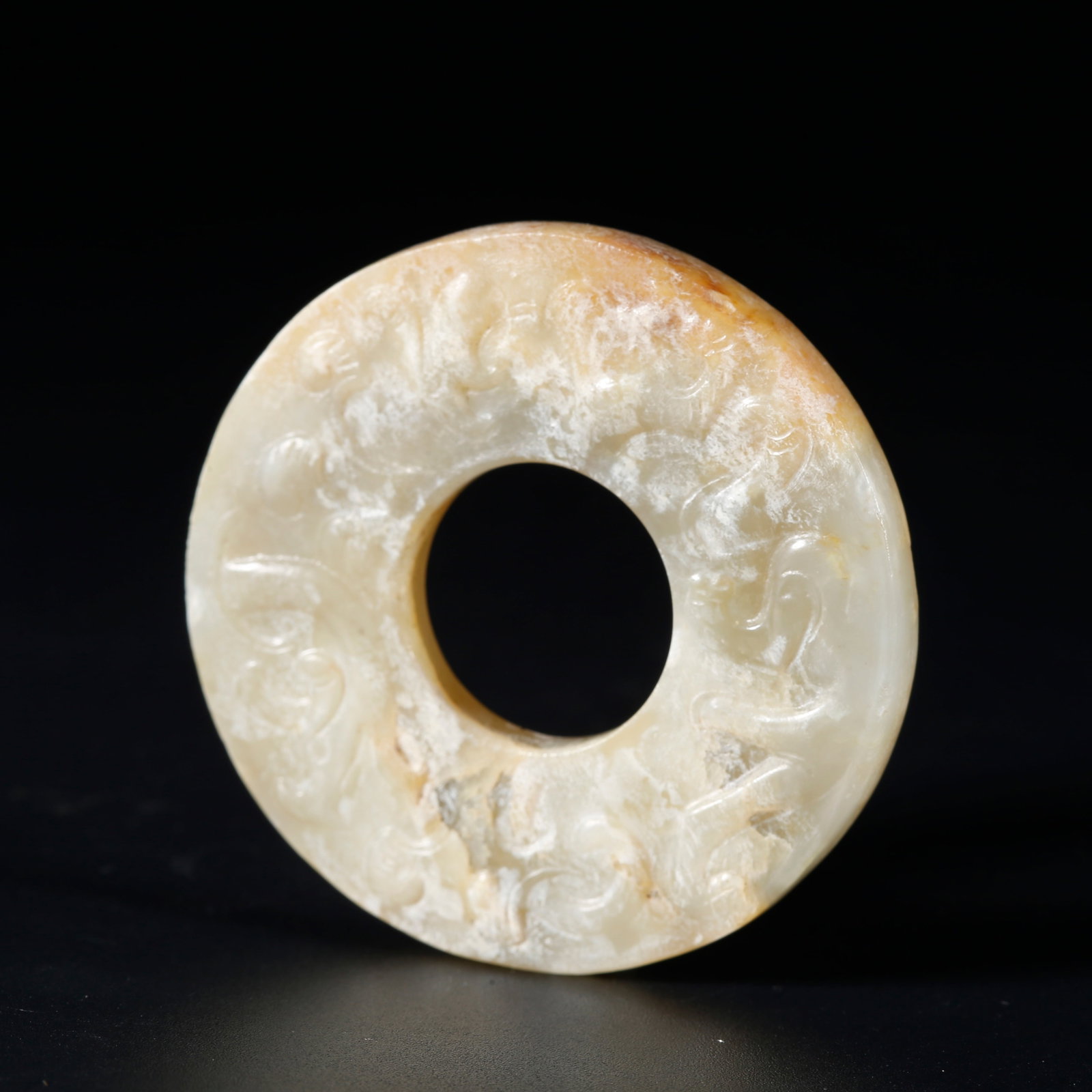 A ARCHAIC JADE SMALL BI DISC WITH DRAGON CARVINGS: Archaic Jade Small Bi Disc with Dragon Carvings
