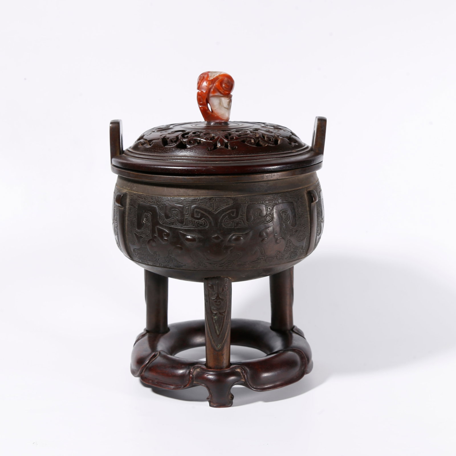 A BRONZE TRIPOD CENSER WITH BEAST MASK PATTERNS: Bronze Tripod Censer with Beast Mask Patterns
