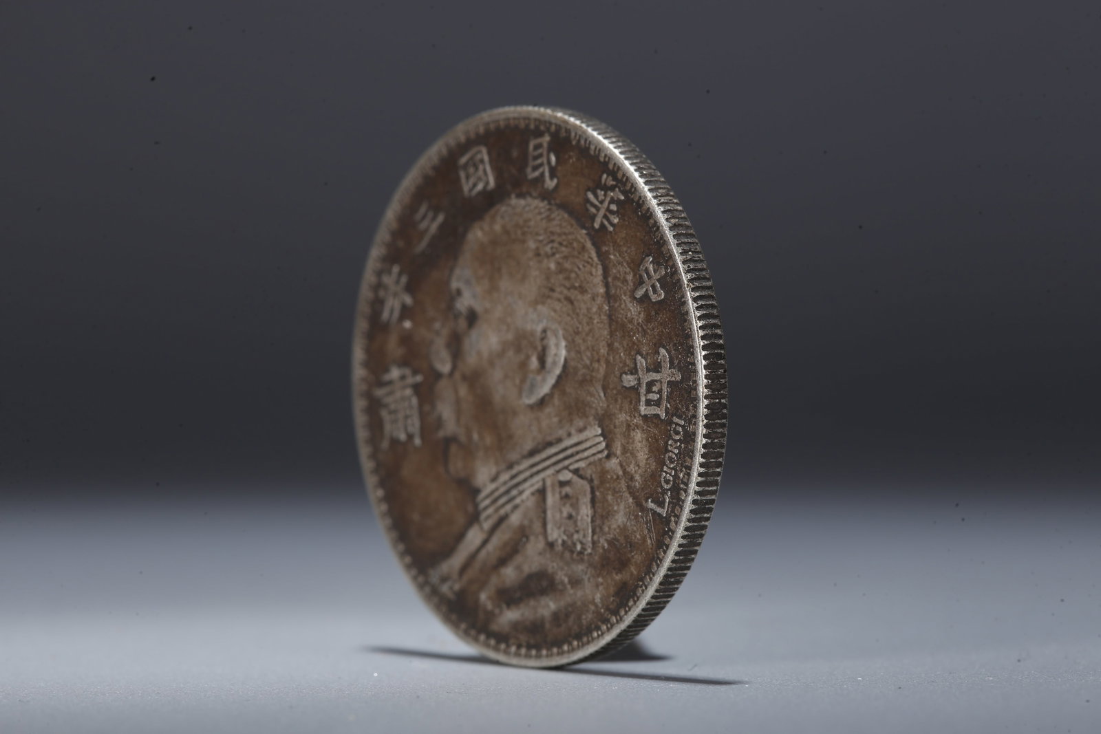 A SILVER DOLLAR COIN - 2