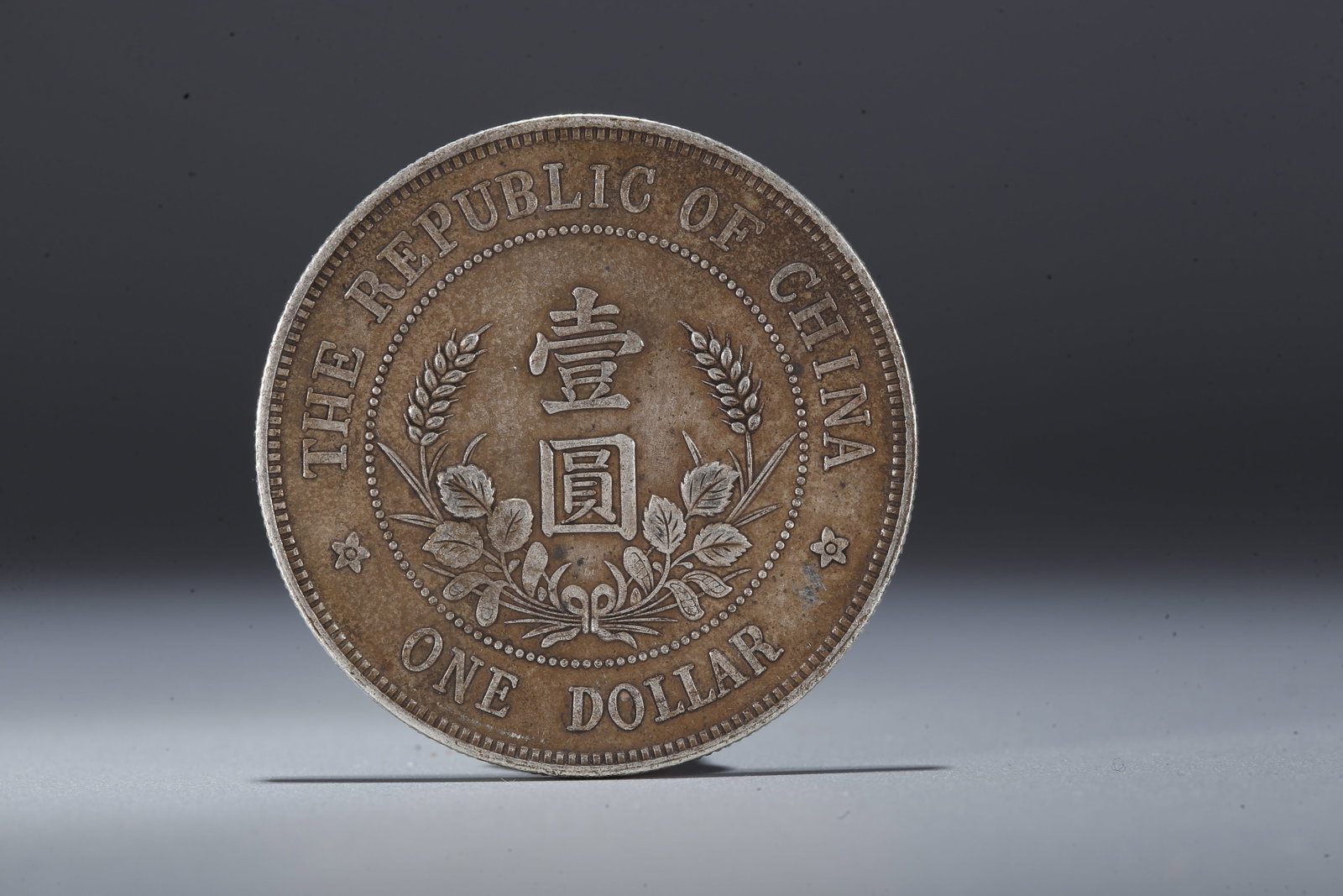 A SILVER DOLLAR COIN - 3