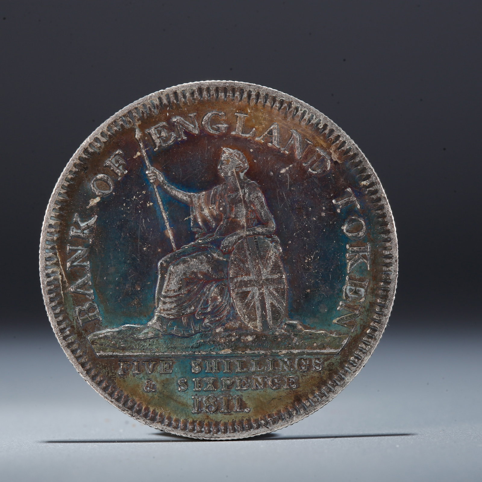 A SILVER DOLLAR COIN: One Silver Dollar Coin
