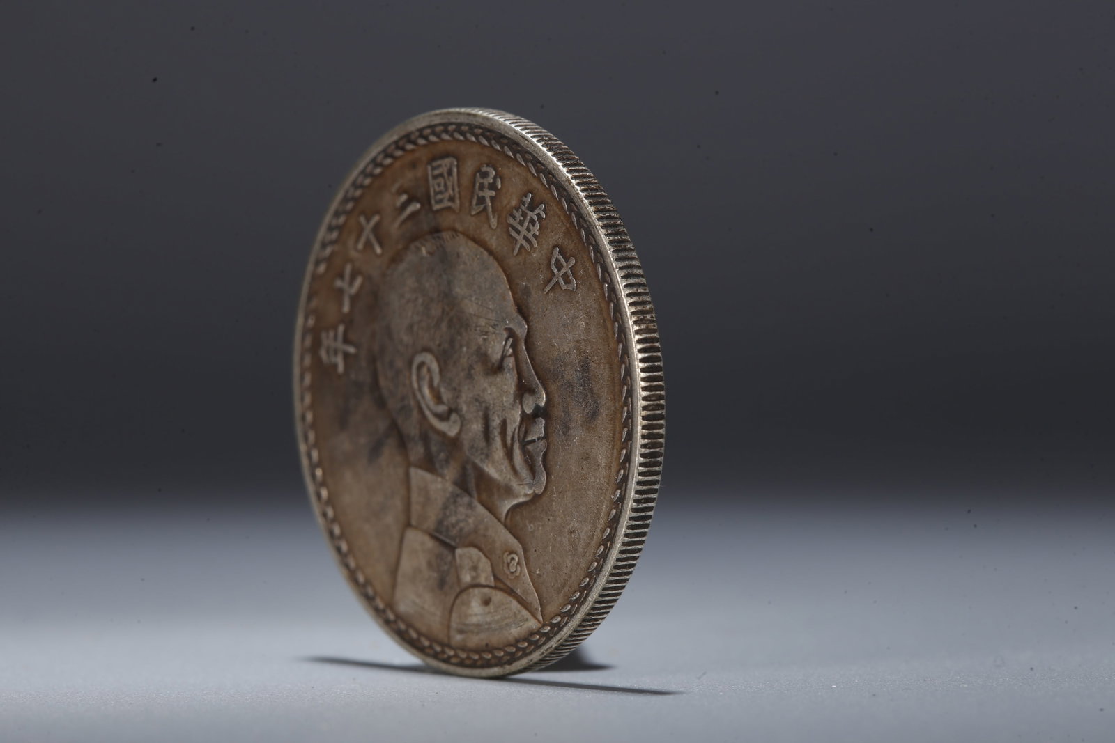 A SILVER DOLLAR COIN - 2