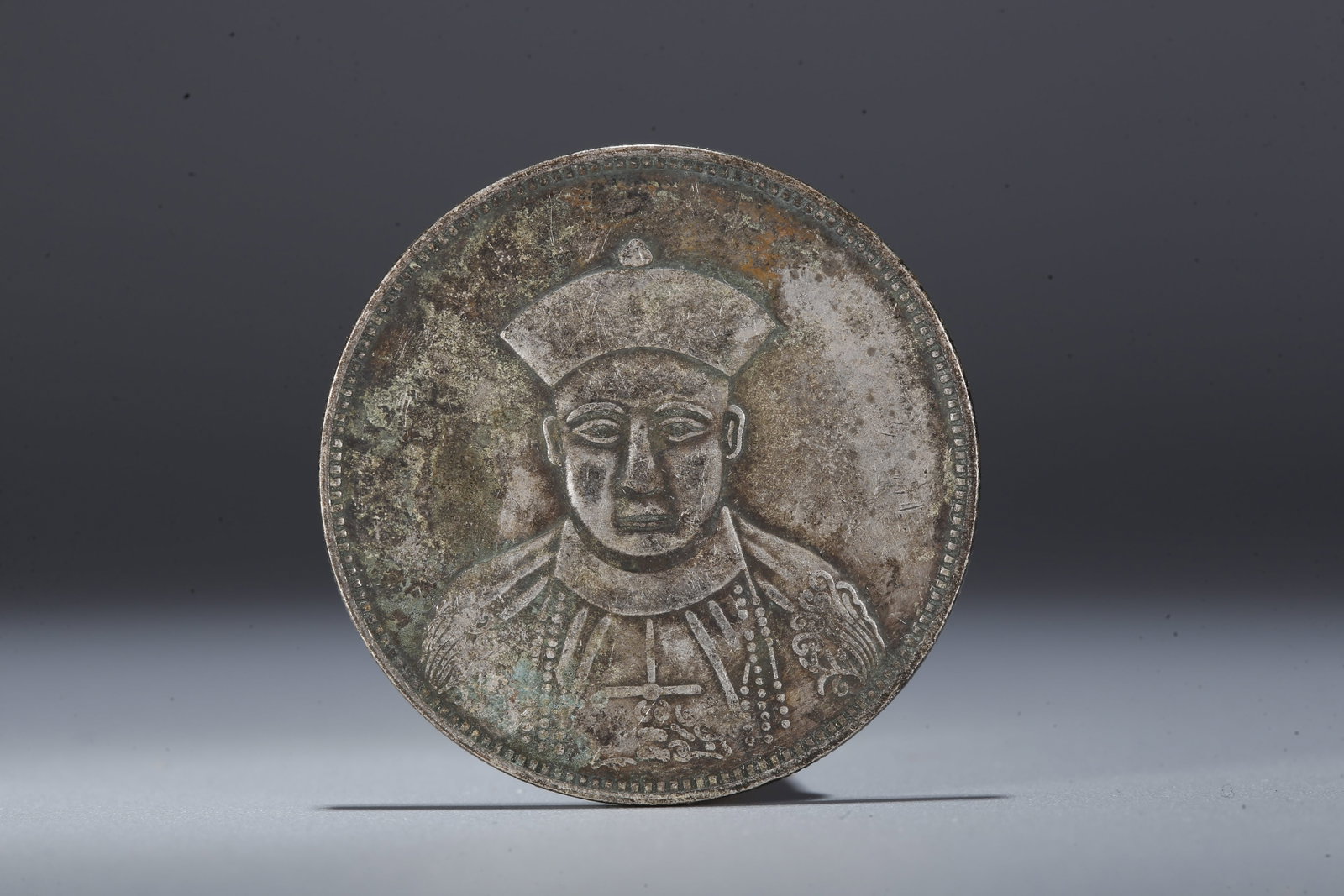 A SILVER DOLLAR COIN - 3