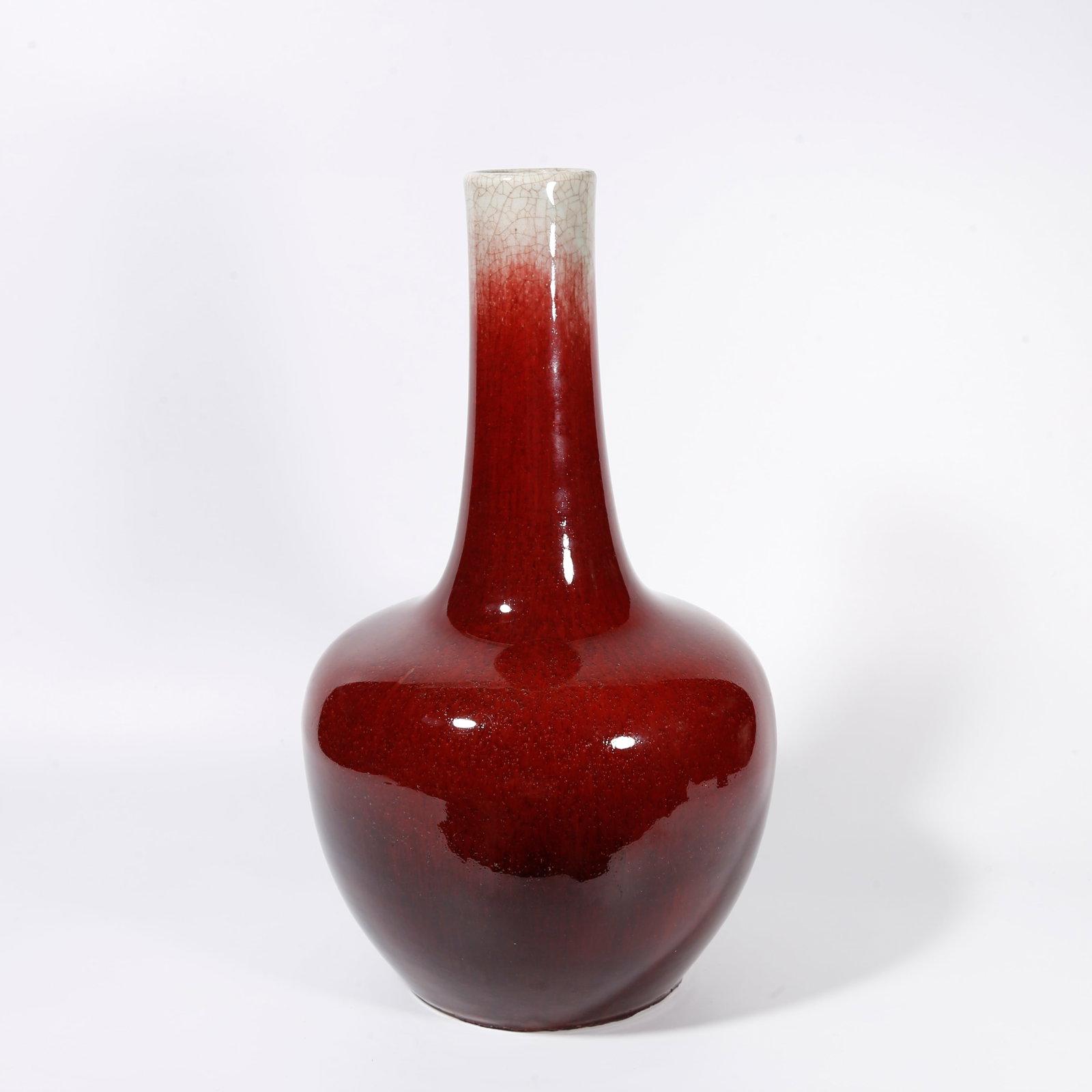 A RED GLAZE LONG NECK VASE: Red Glaze Long Neck Vase
