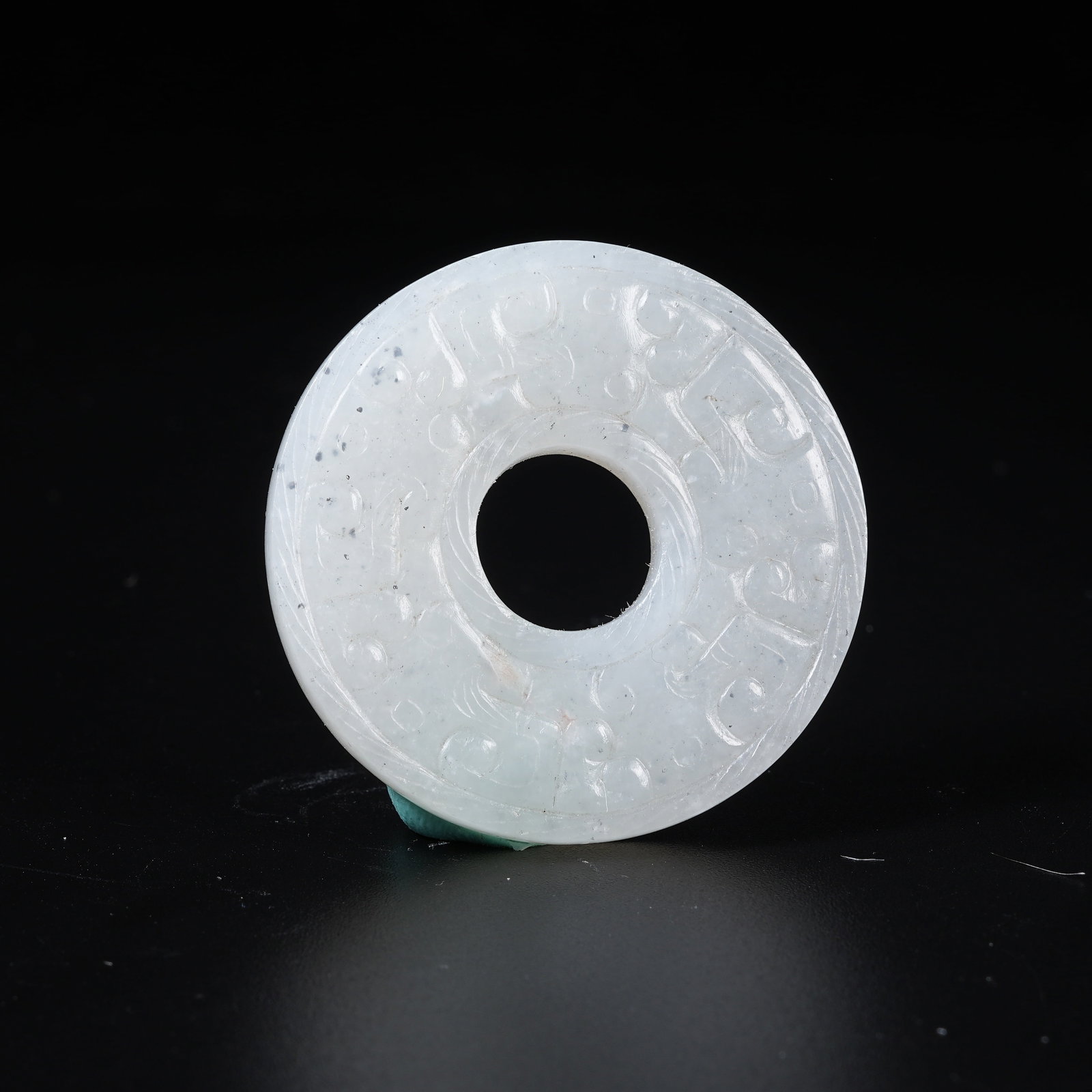 A ANCIENT JADE BI DISC WITH HOOKED CLOUD PATTERN (1 of 9)