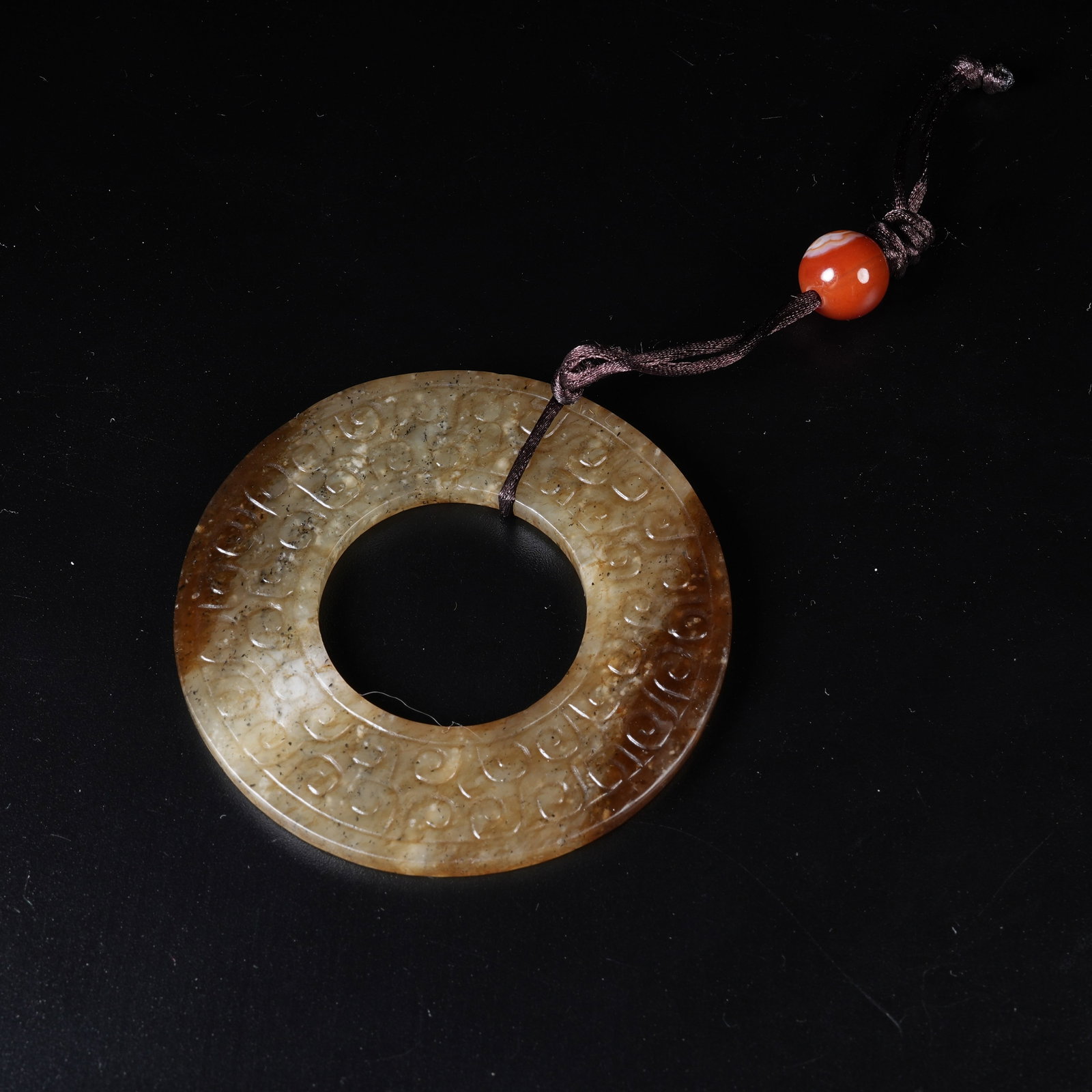 A ANCIENT JADE BI DISC WITH HOOKED CLOUD PATTERN (1 of 10)