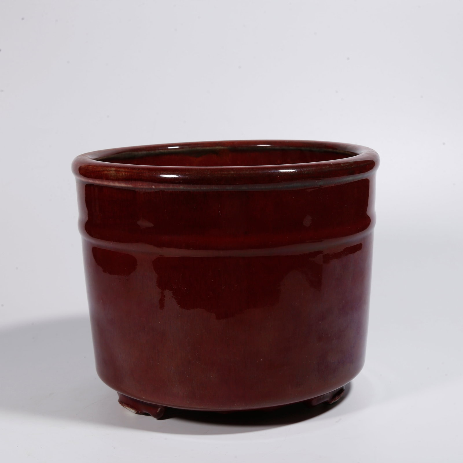 A SACRIFICIAL RED GLAZE CYLINDRICAL CENSER: Sacrificial Red Glaze Cylindrical Censer