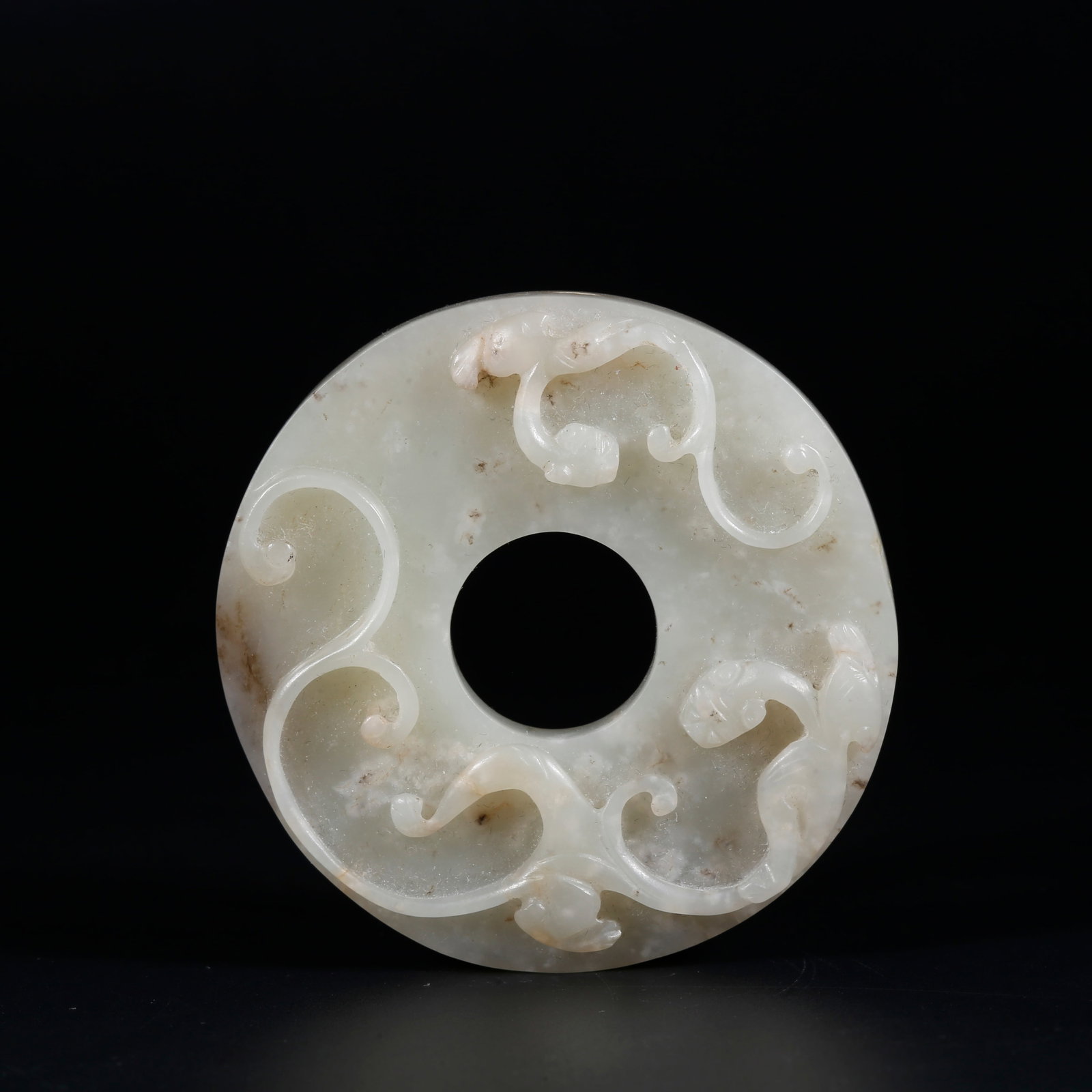 A HETIAN JADE BI DISC CARVED WITH DRAGON PATTERNS (1 of 9)