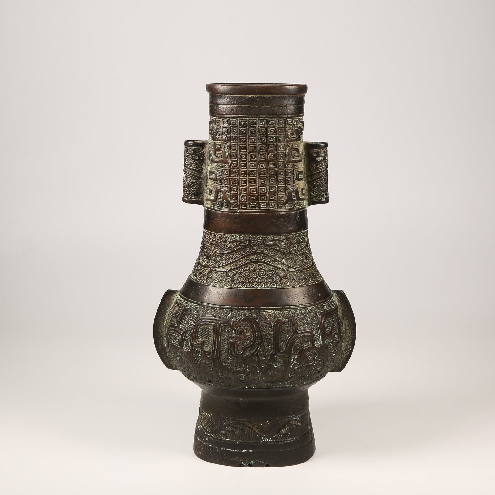 A BRONZE EWER WITH DRAGON MOTIFS AND UPRIGHT FINIALS, ANIMAL-FORM HANDLES (1 of 9)