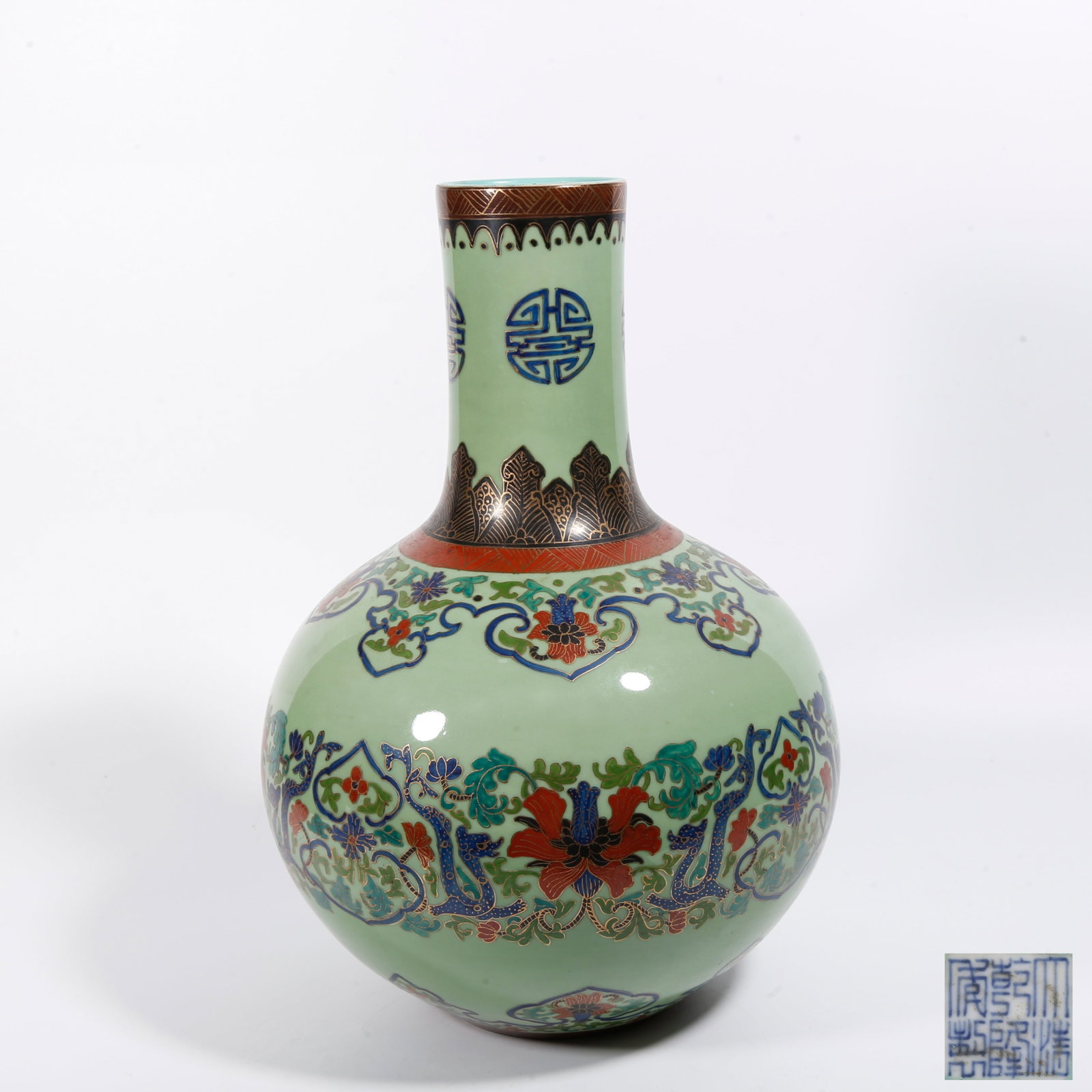 A TURQUOISE GREEN GLAZE CELESTIAL SPHERE VASE WITH INTERLOCKING FLORAL PATTERN: Turquoise Green Glaze Celestial Sphere Vase with Interlocking Floral Pattern