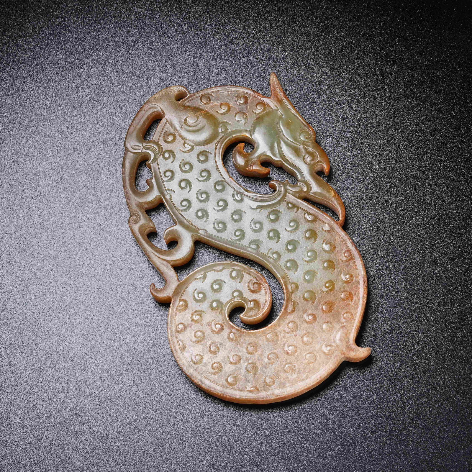 A ARCHAIC JADE S-SHAPED DRAGON PENDANT (1 of 9)