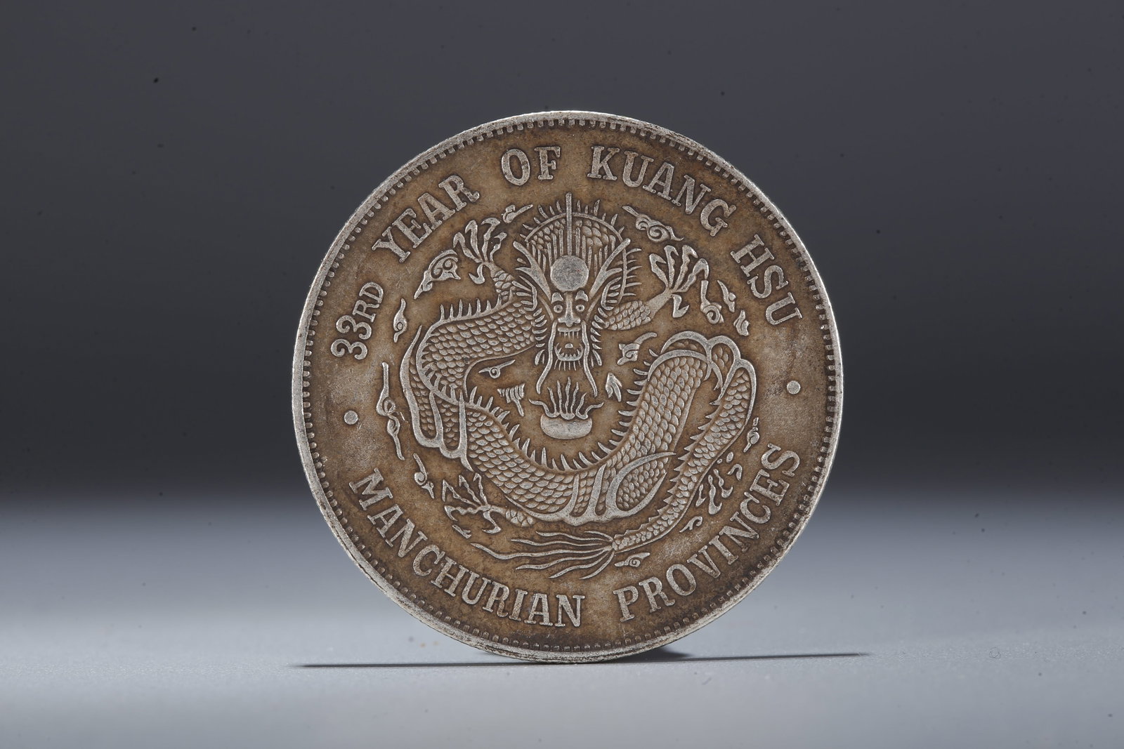 A SILVER DOLLAR COIN - 3