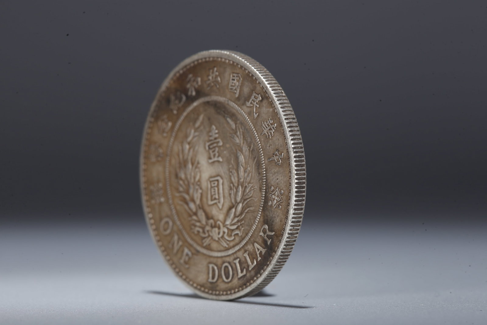 A SILVER DOLLAR COIN - 2