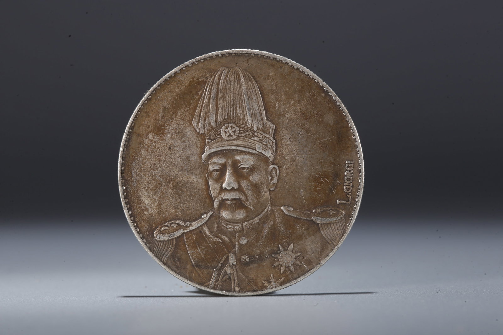 A SILVER DOLLAR COIN - 3