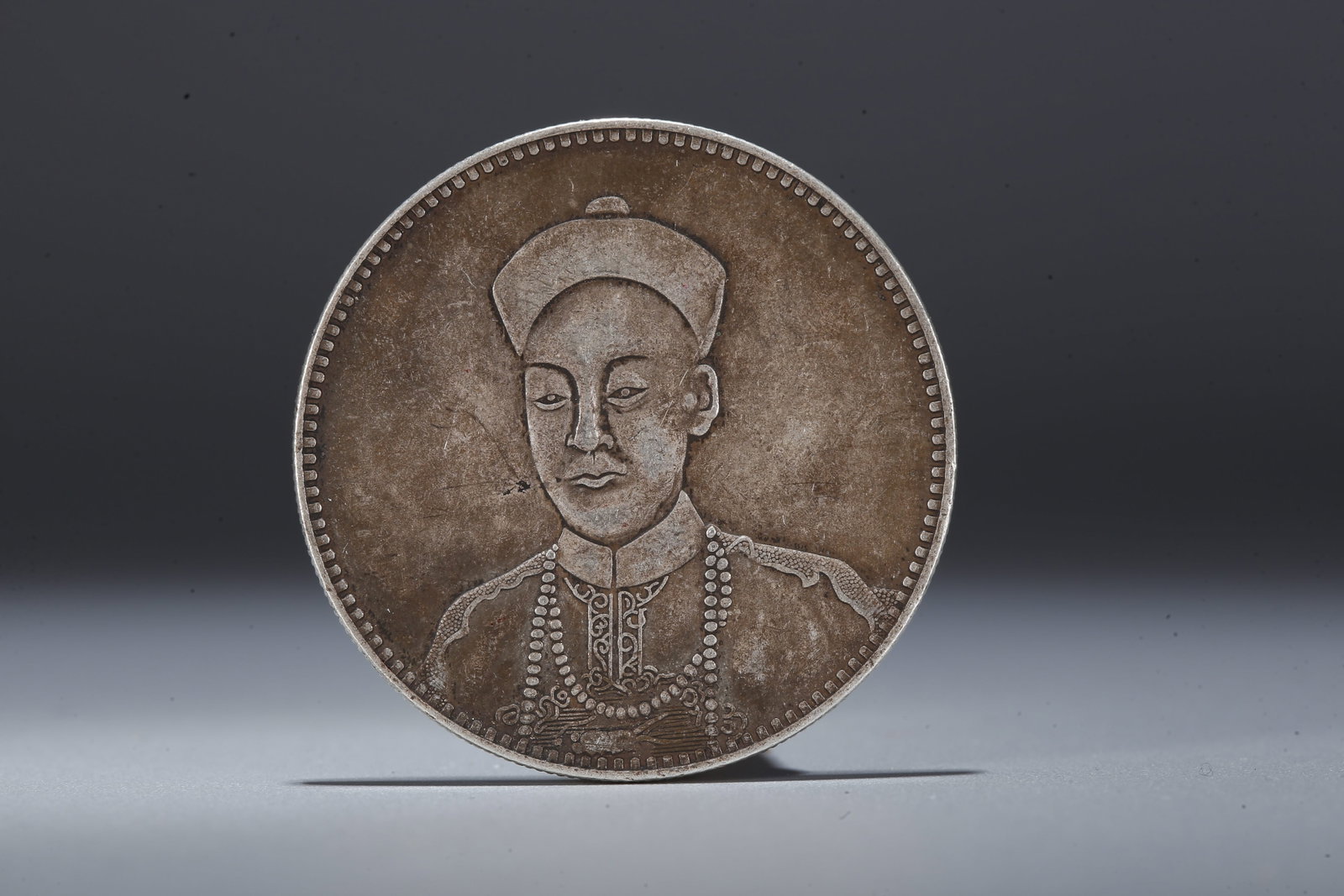 A SILVER DOLLAR COIN - 3